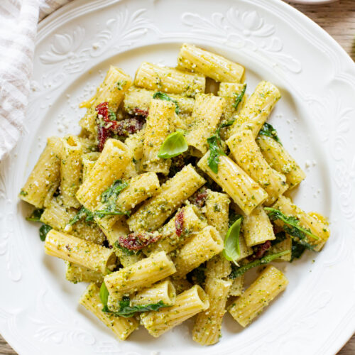 This Arugula Pesto Rigatoni is dairy-free and delicious. Arugula adds a peppery bite to the basil pesto. A quick & easy vegan dinner | ThisSavoryVegan.com