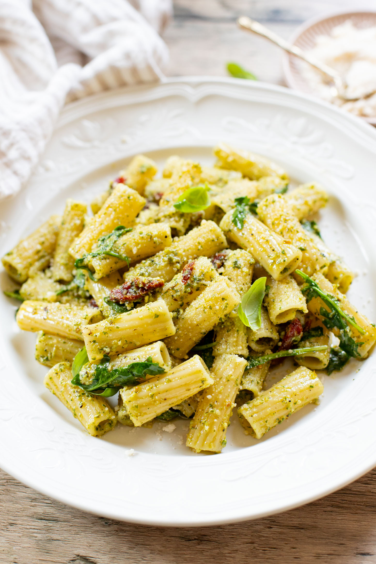 This Arugula Pesto Rigatoni is dairy-free and delicious. Arugula adds a peppery bite to the basil pesto. A quick & easy vegan dinner | ThisSavoryVegan.com