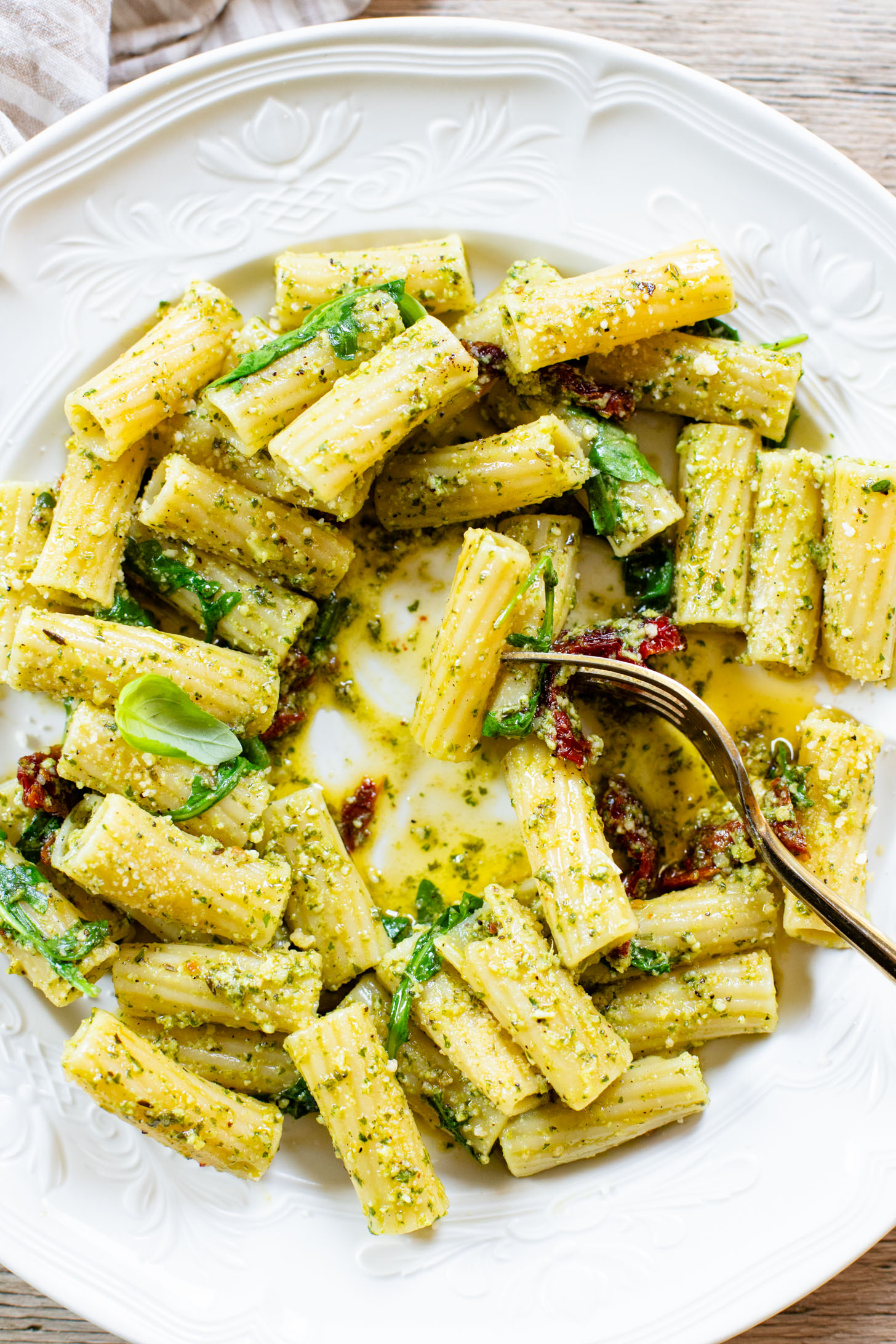 This Arugula Pesto Rigatoni is dairy-free and delicious. Arugula adds a peppery bite to the basil pesto. A quick & easy vegan dinner | ThisSavoryVegan.com