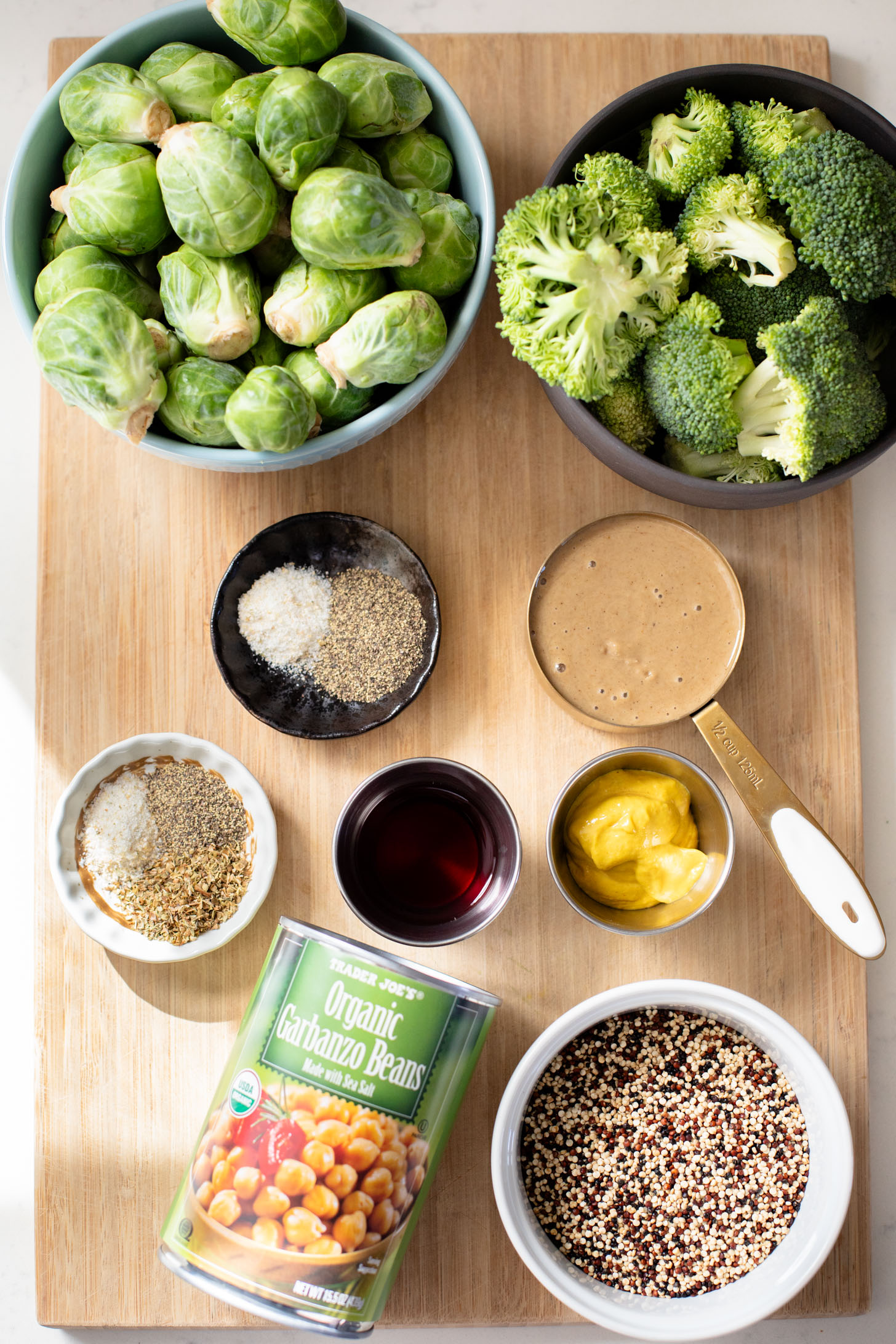 These Roasted Veggie Quinoa Bowls make the best vegan lunch or dinner! Topped with a mustard tahini dressing for the perfect bite | ThisSavoryVegan.com