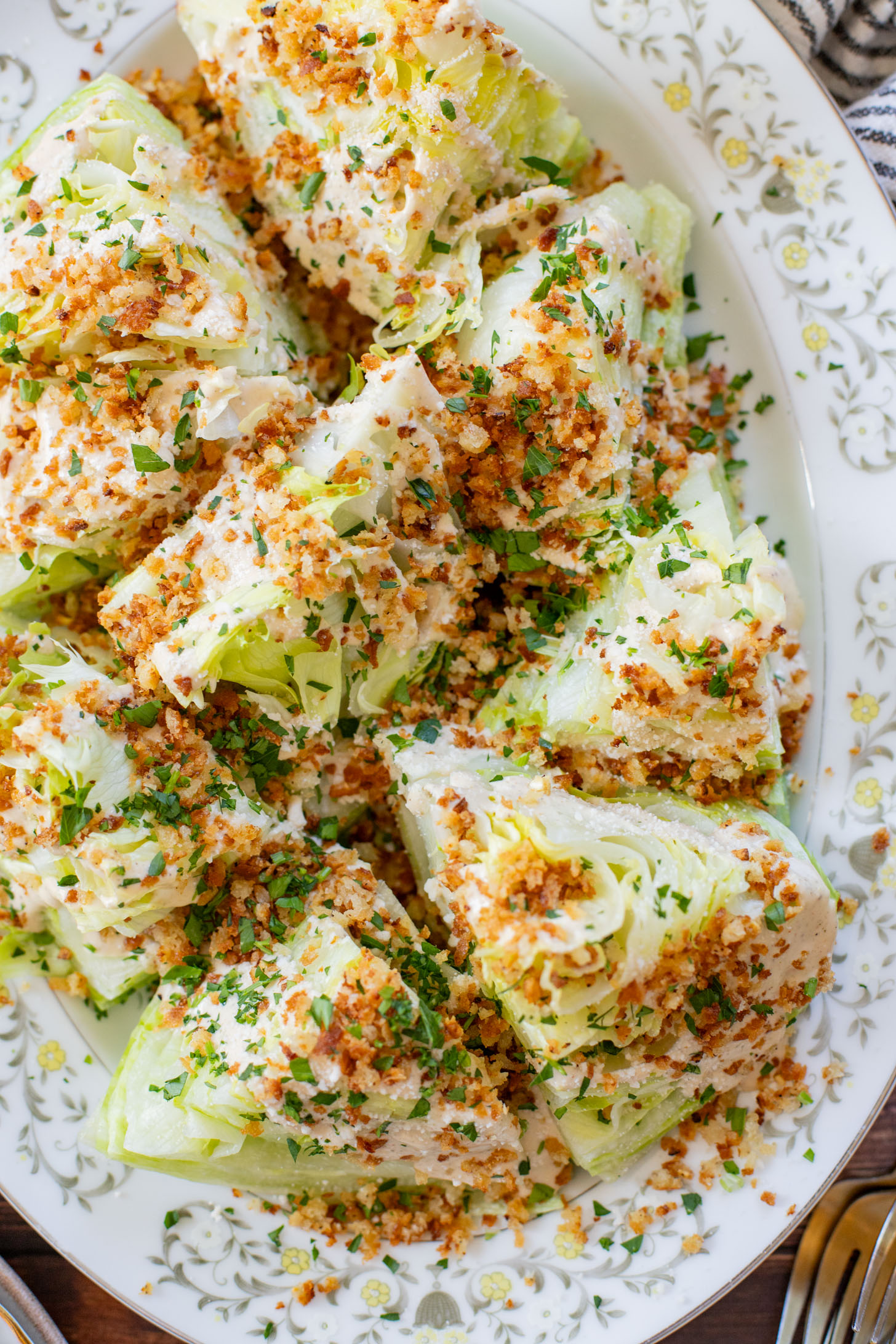 This Spicy Caesar Wedge Salad is the BEST party salad. Made with vegan Caesar dressing and topped with garlic bread crumbs | ThisSavoryVegan.com