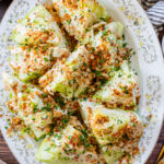 This Spicy Caesar Wedge Salad is the BEST party salad. Made with vegan Caesar dressing and topped with garlic bread crumbs | ThisSavoryVegan.com
