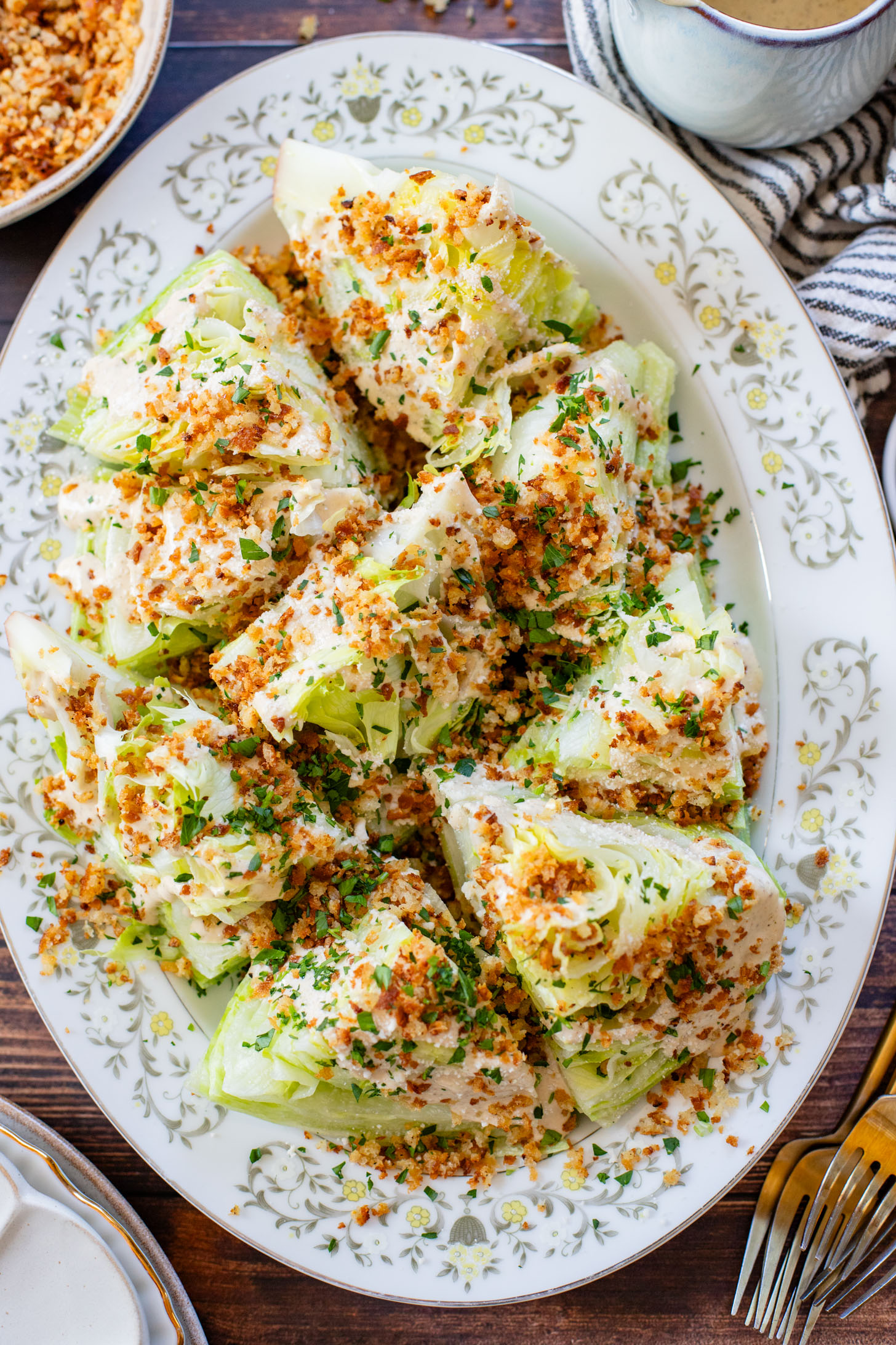 This Spicy Caesar Wedge Salad is the BEST party salad. Made with vegan Caesar dressing and topped with garlic bread crumbs | ThisSavoryVegan.com