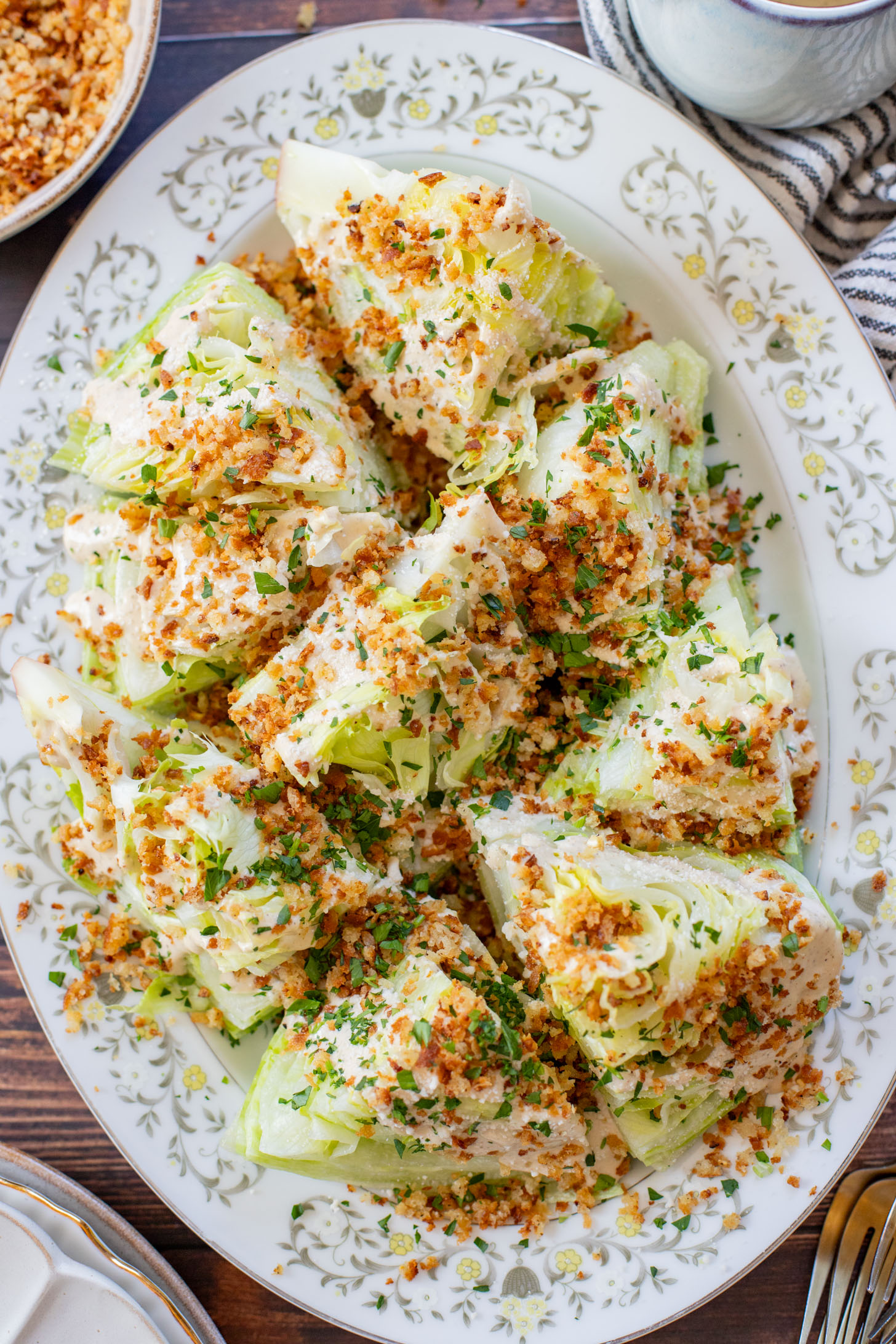 This Spicy Caesar Wedge Salad is the BEST party salad. Made with vegan Caesar dressing and topped with garlic bread crumbs | ThisSavoryVegan.com