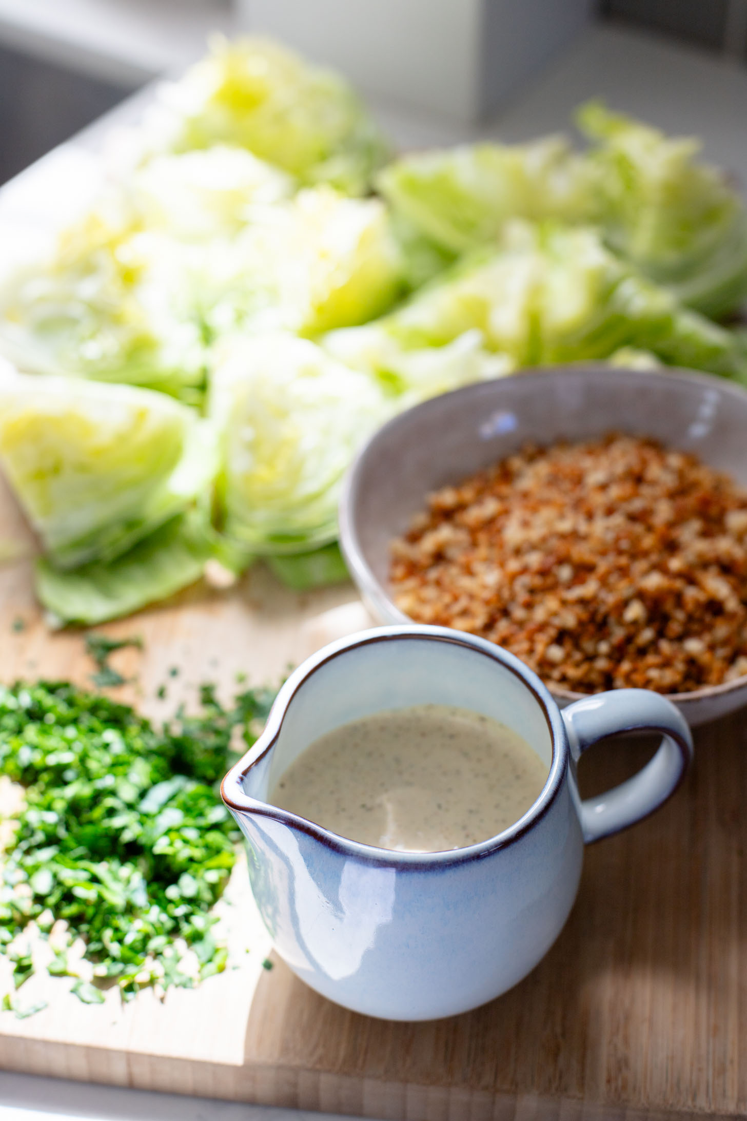 This Spicy Caesar Wedge Salad is the BEST party salad. Made with vegan Caesar dressing and topped with garlic bread crumbs | ThisSavoryVegan.com