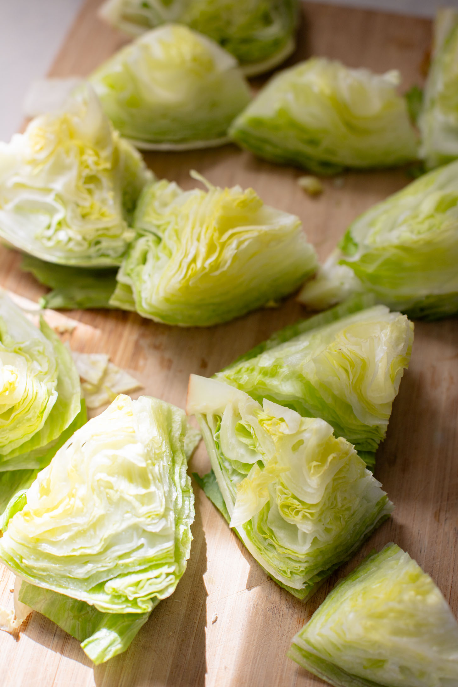 This Spicy Caesar Wedge Salad is the BEST party salad. Made with vegan Caesar dressing and topped with garlic bread crumbs | ThisSavoryVegan.com