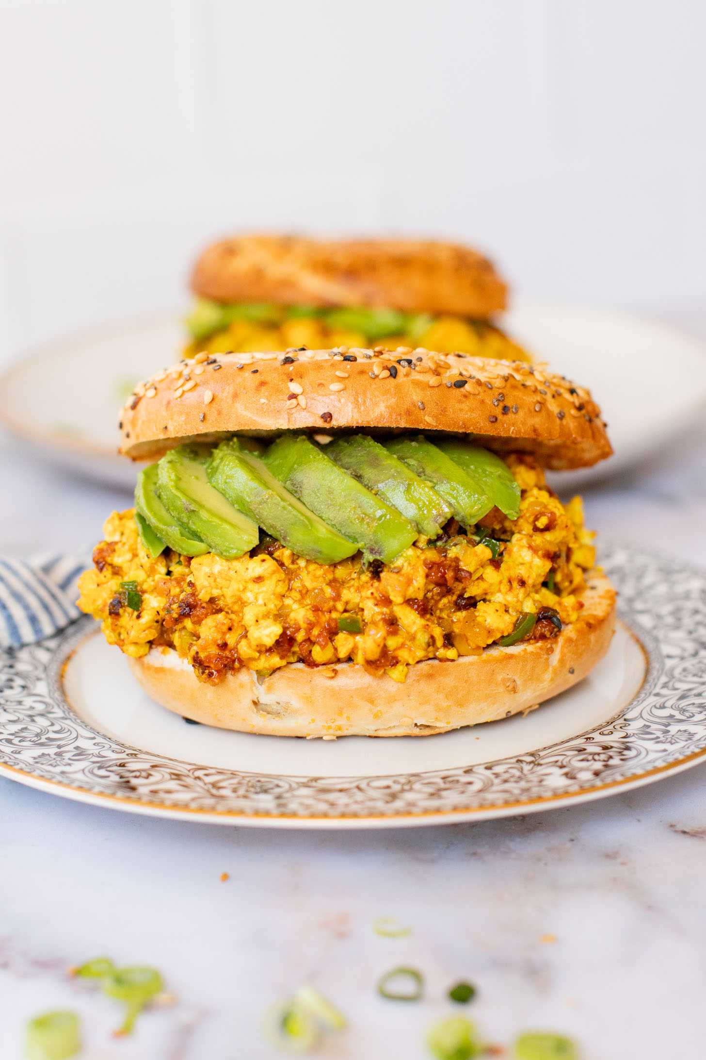 These Tofu Scramble Breakfast Sandwiches are perfect for a weekend brunch at home. This is the best vegan breakfast bagel | ThisSavoryVegan.com