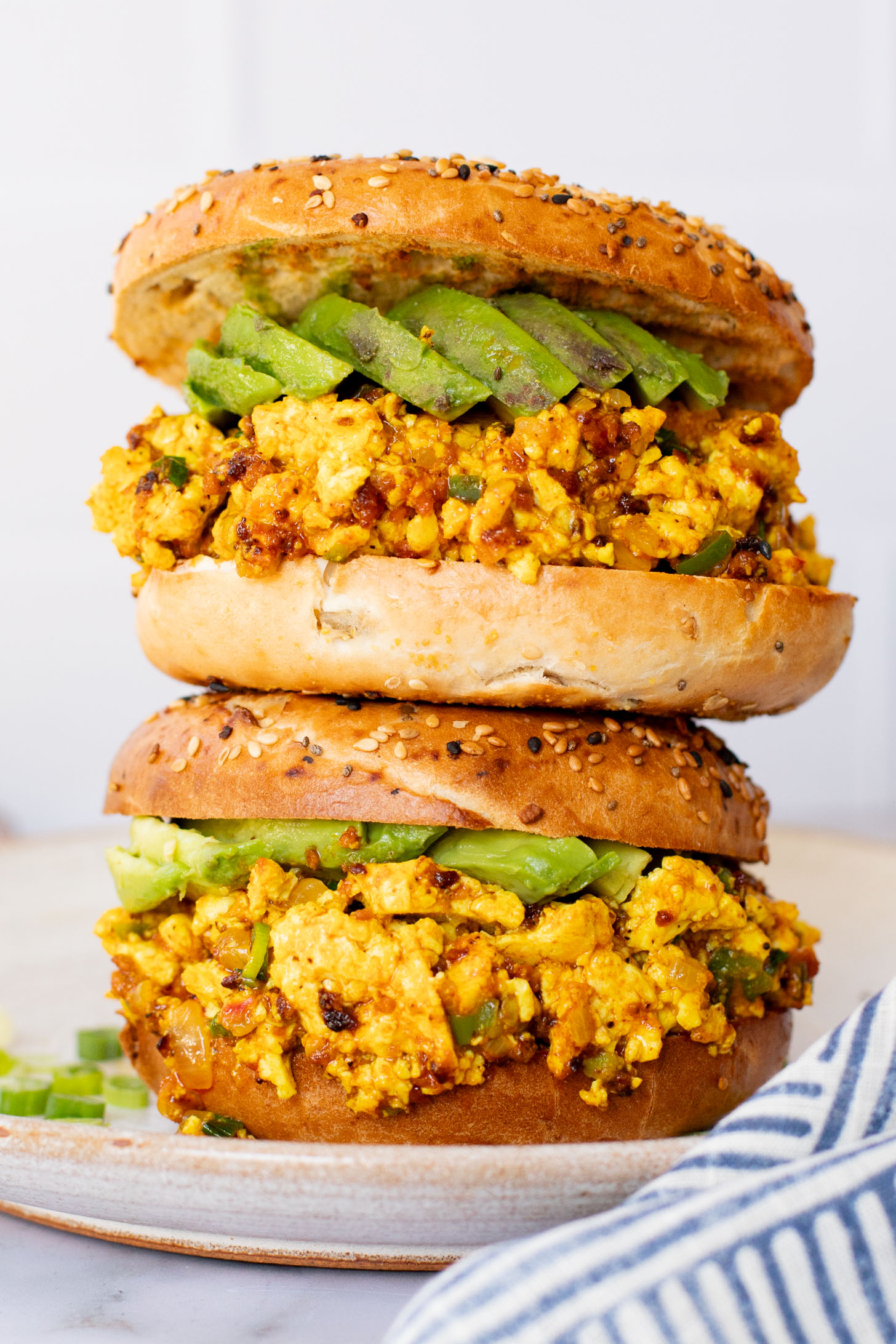 These Tofu Scramble Breakfast Sandwiches are perfect for a weekend brunch at home. This is the best vegan breakfast bagel | ThisSavoryVegan.com