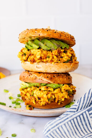 These Tofu Scramble Breakfast Sandwiches are perfect for a weekend brunch at home. This is the best vegan breakfast bagel | ThisSavoryVegan.com