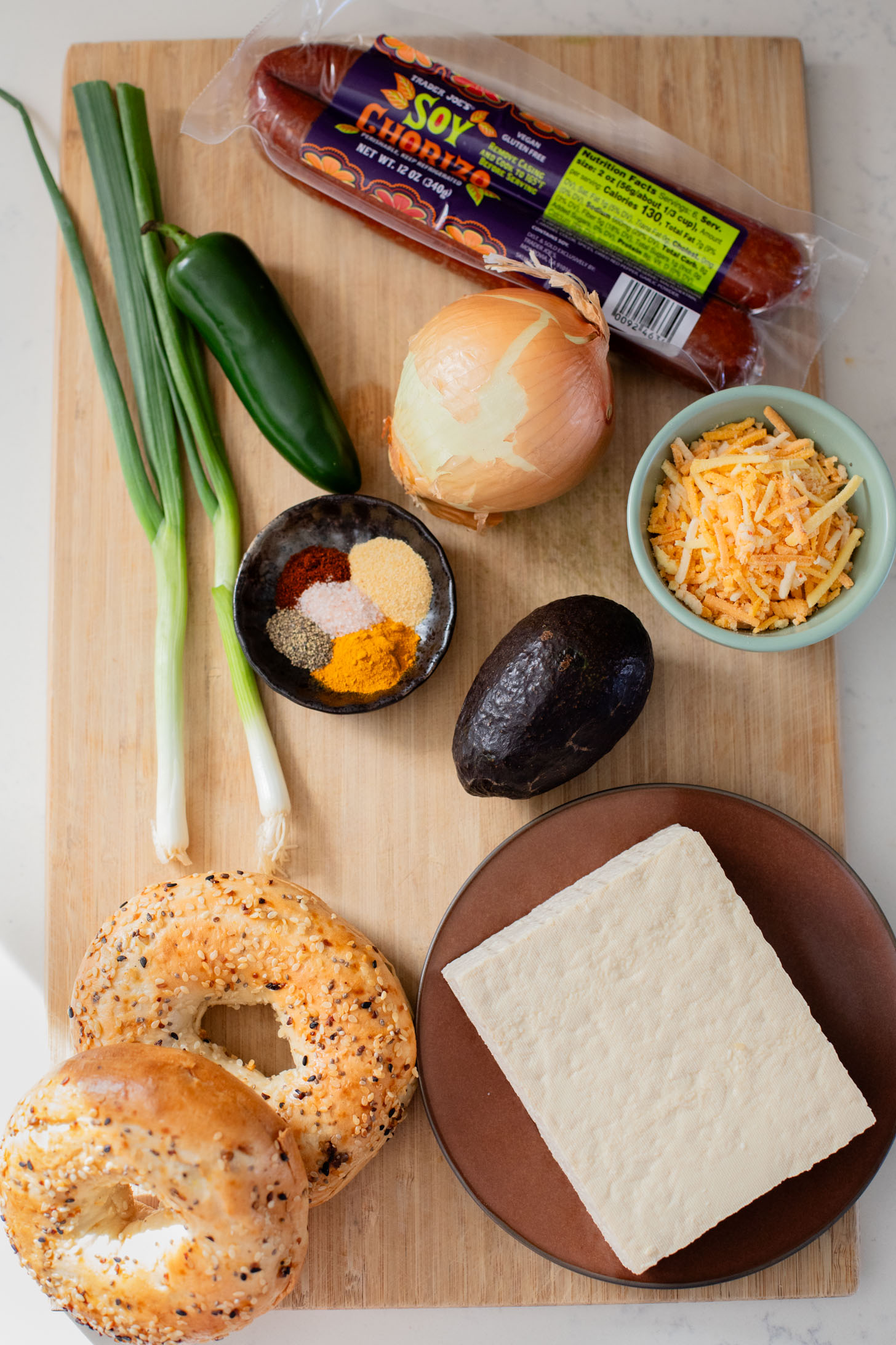 These Tofu Scramble Breakfast Sandwiches are perfect for a weekend brunch at home. This is the best vegan breakfast bagel | ThisSavoryVegan.com