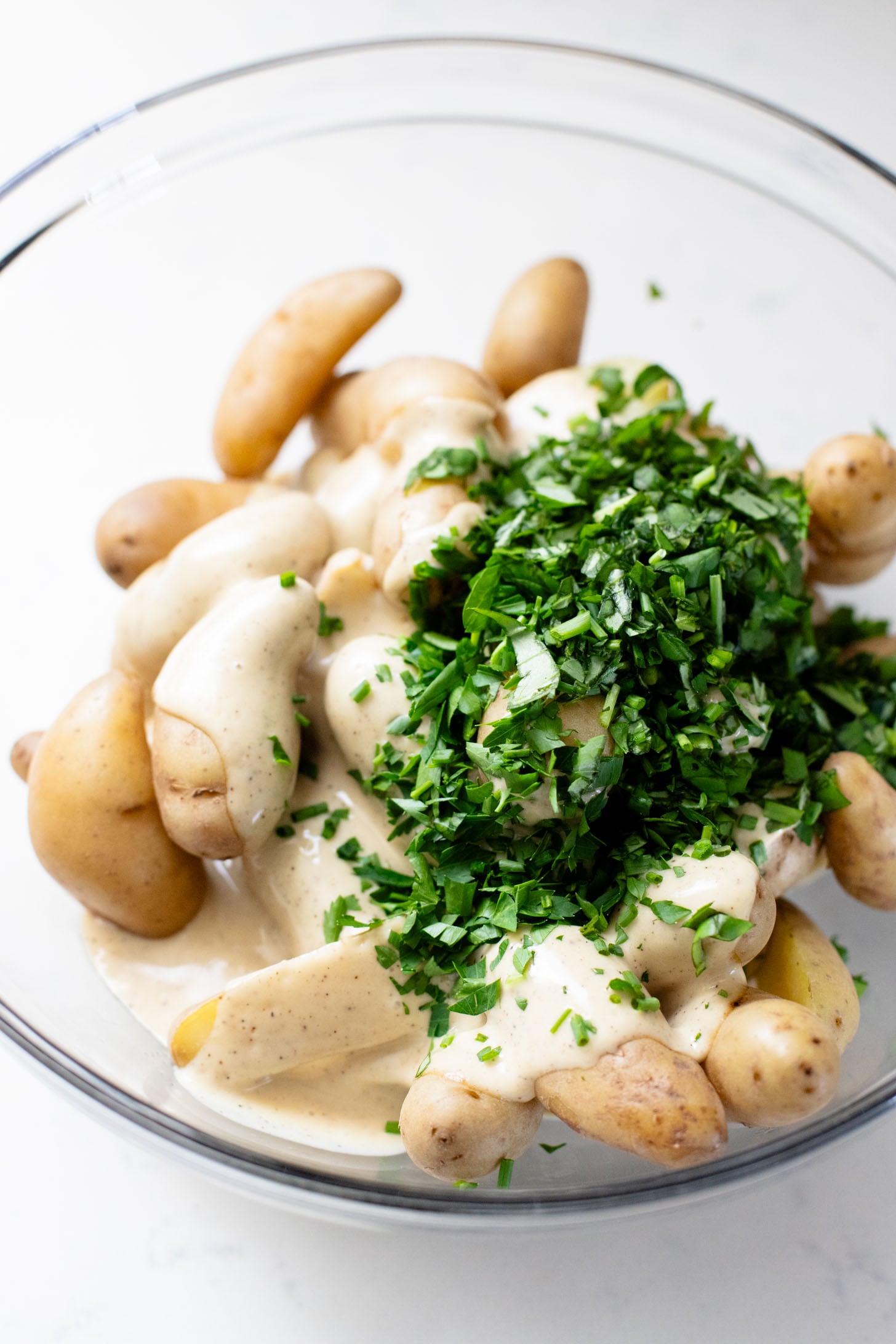 This Vegan Honey Mustard Potato Salad is the perfect spring side dish! Made with fingerling potatoes and a tangy mustard dressing | ThisSavoryVegan.com
