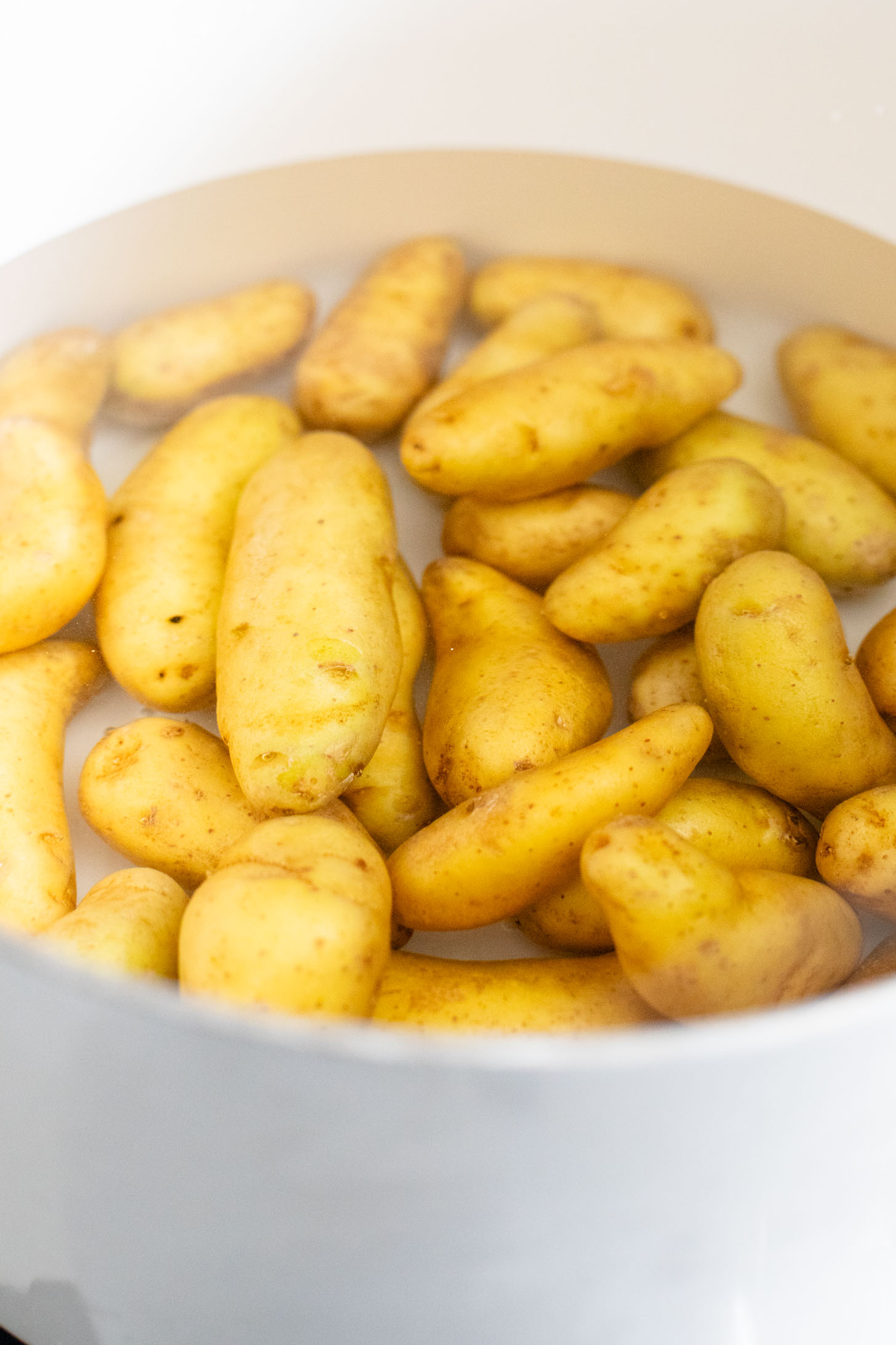 This Vegan Honey Mustard Potato Salad is the perfect spring side dish! Made with fingerling potatoes and a tangy mustard dressing | ThisSavoryVegan.com