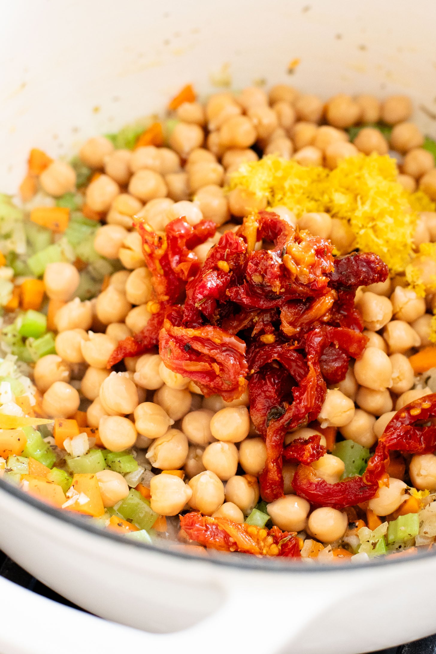 This Creamy Lemon Couscous Soup is bright and fresh. Made with a delicious broth, veggies, chickpeas, couscous and plenty of lemon juice | ThisSavoryVegan.com