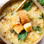 This Creamy Lemon Couscous Soup is bright and fresh. Made with a delicious broth, veggies, chickpeas, couscous and plenty of lemon juice | ThisSavoryVegan.com