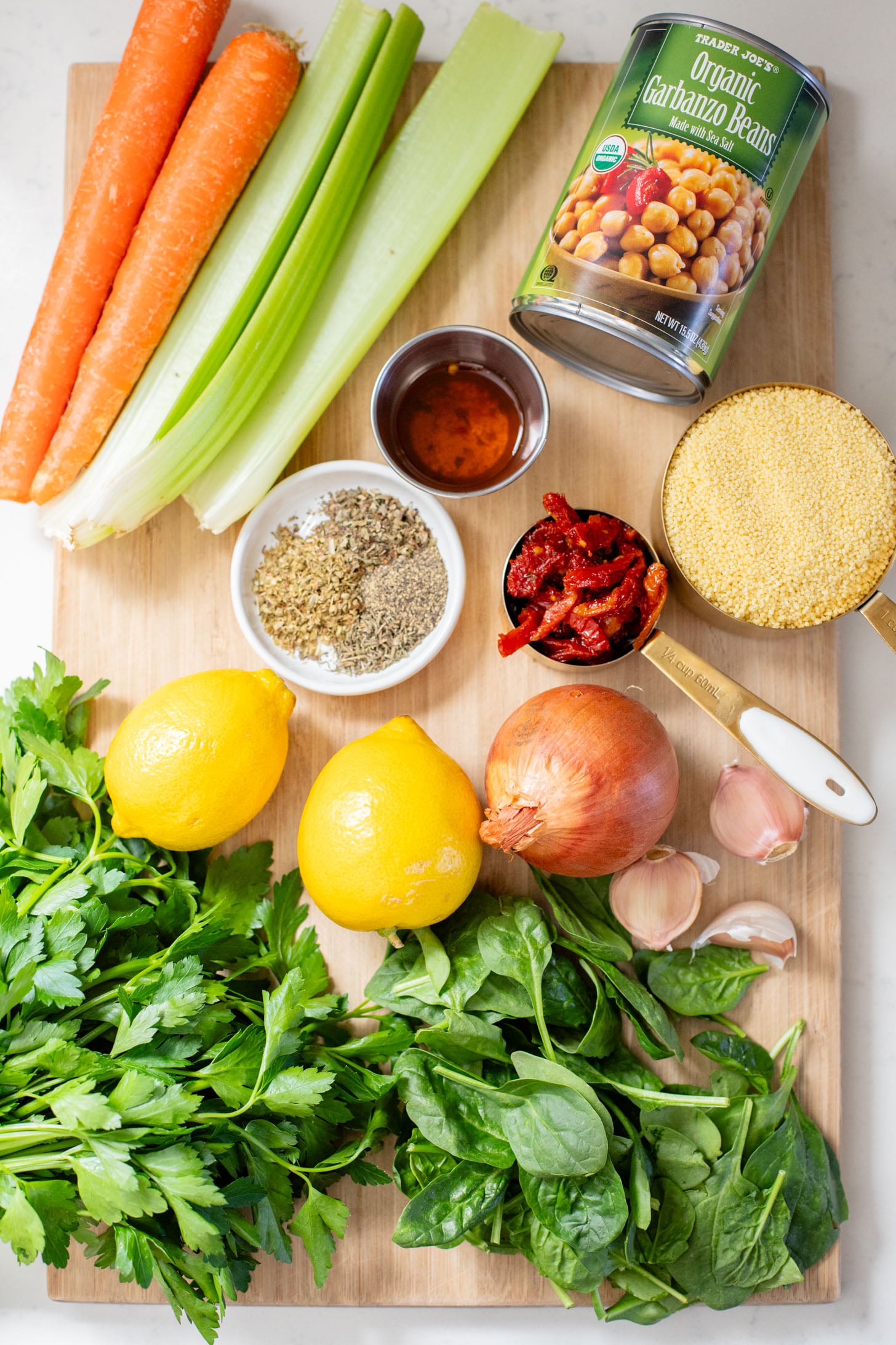 This Creamy Lemon Couscous Soup is bright and fresh. Made with a delicious broth, veggies, chickpeas, couscous and plenty of lemon juice | ThisSavoryVegan.com