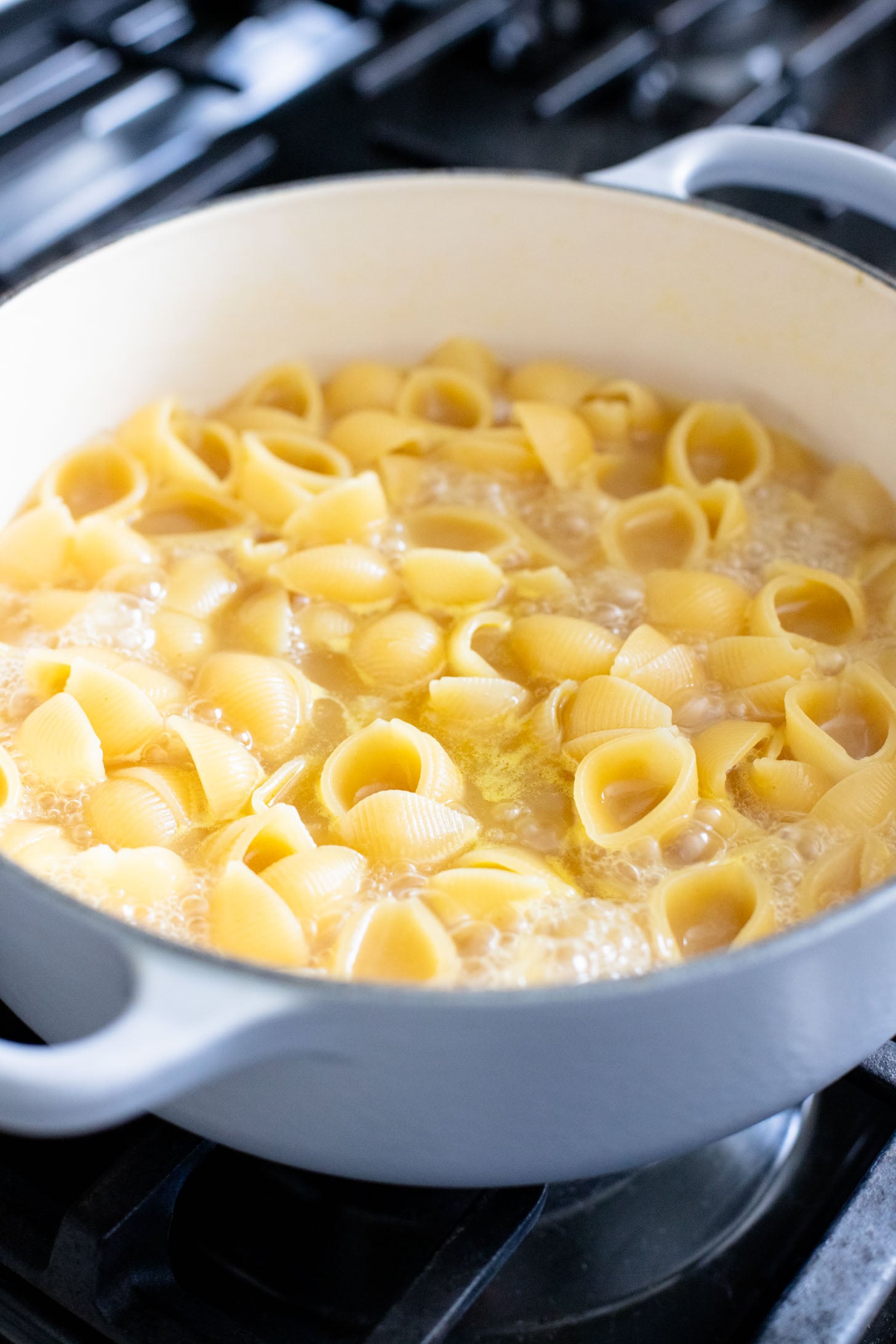 This Creamy Spinach Tofu Shells recipe is a comforting vegan pasta that sneaks in protein & veggies. Made in one pot for easy clean up | ThisSavoryVegan.com