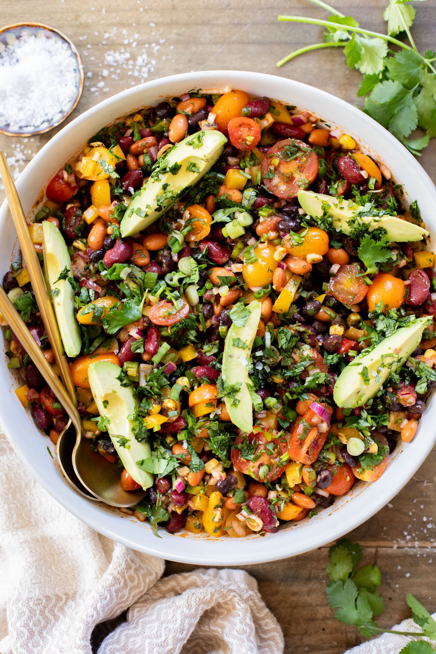 This Dense Bean Taco Salad is the perfect meal prep idea. Three types of beans, lots of veggies and a smoky chipotle dressing | ThisSavoryVegan.com