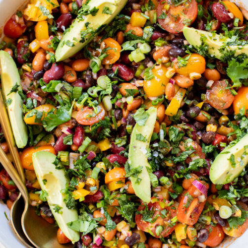 This Dense Bean Taco Salad is the perfect meal prep idea. Three types of beans, lots of veggies and a smoky chipotle dressing | ThisSavoryVegan.com