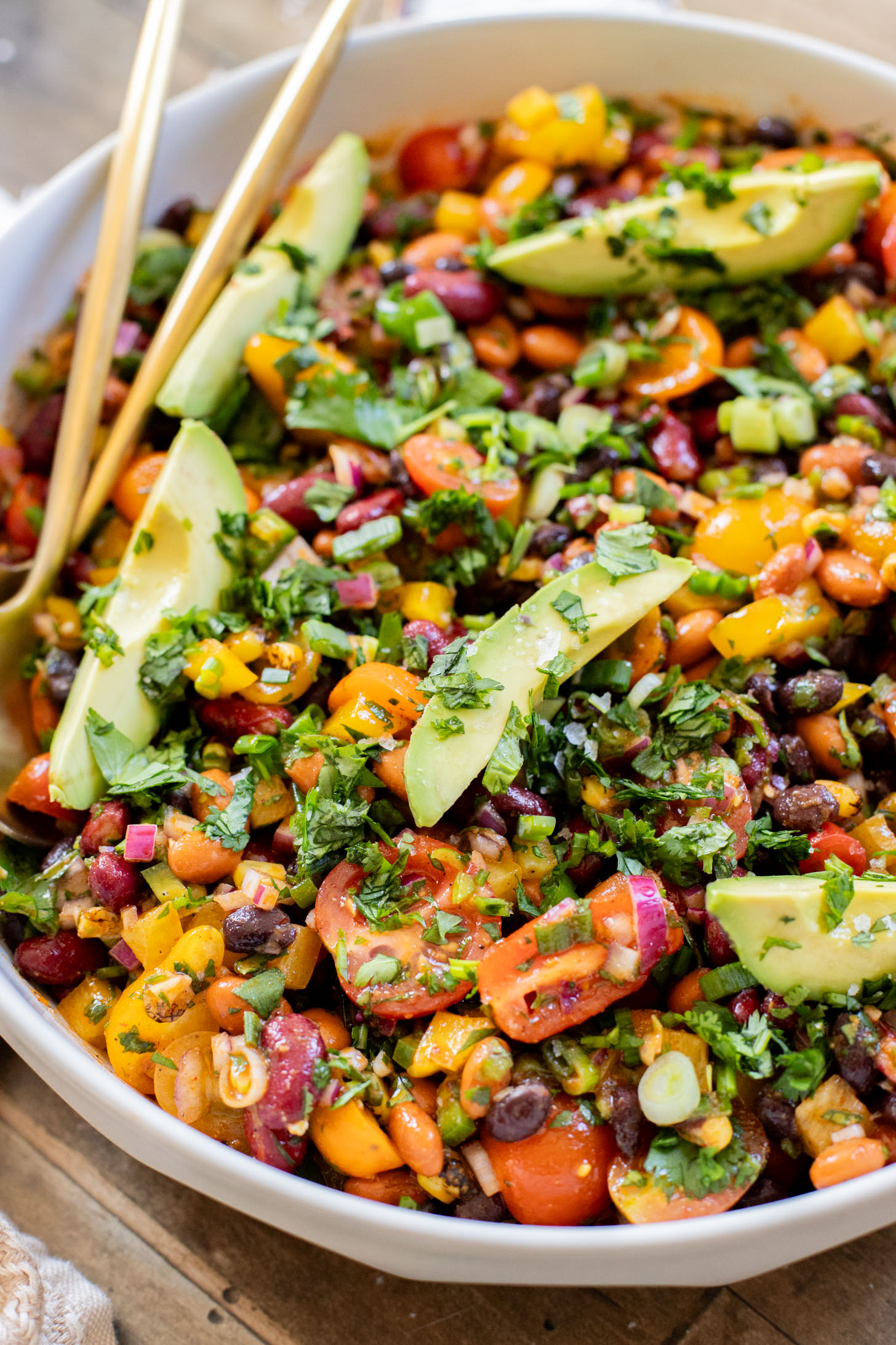 This Dense Bean Taco Salad is the perfect meal prep idea. Three types of beans, lots of veggies and a smoky chipotle dressing | ThisSavoryVegan.com