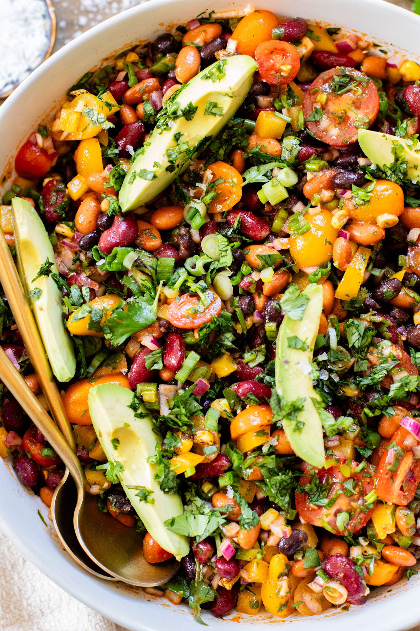 This Dense Bean Taco Salad is the perfect meal prep idea. Three types of beans, lots of veggies and a smoky chipotle dressing | ThisSavoryVegan.com