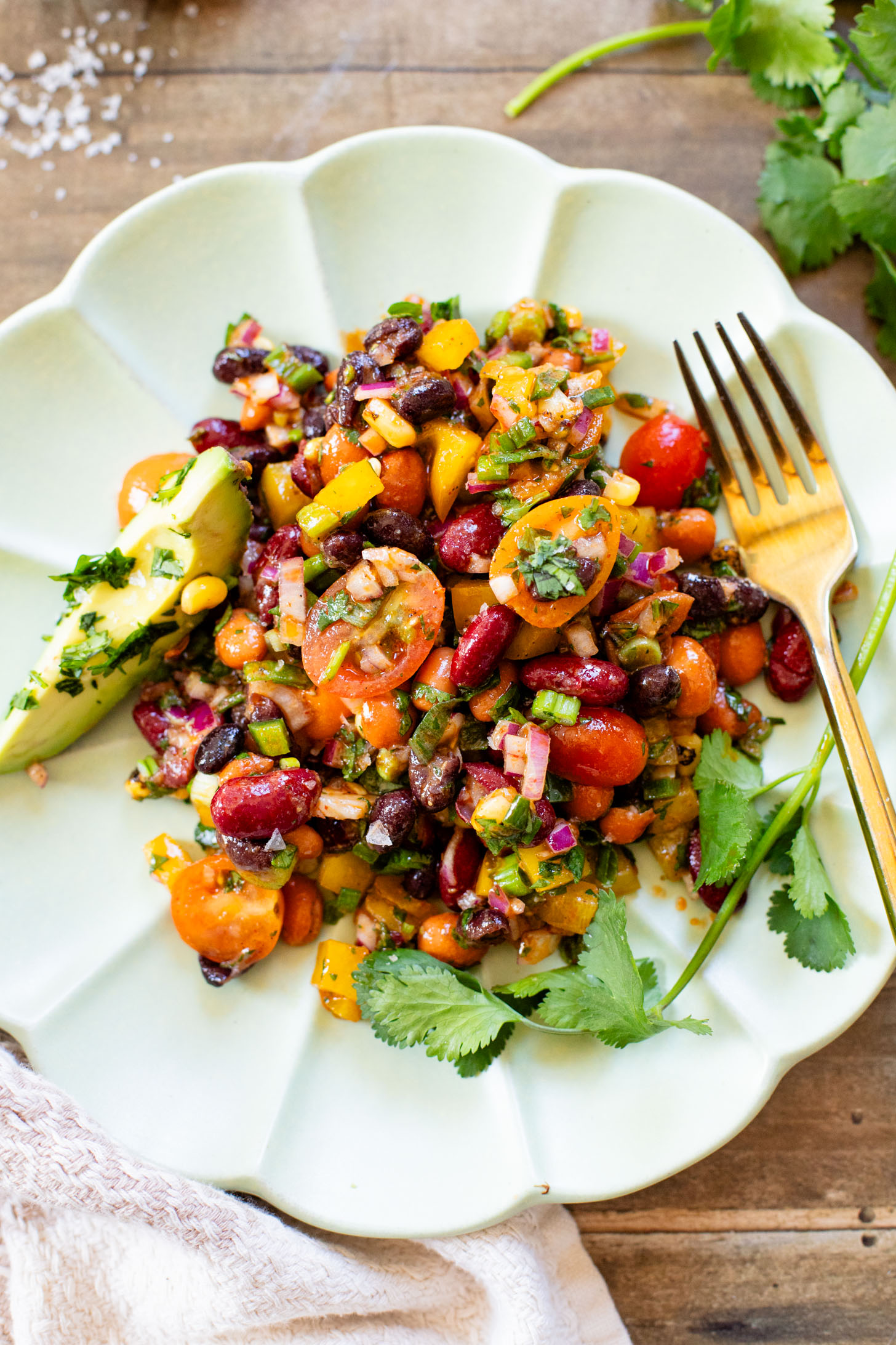This Dense Bean Taco Salad is the perfect meal prep idea. Three types of beans, lots of veggies and a smoky chipotle dressing | ThisSavoryVegan.com