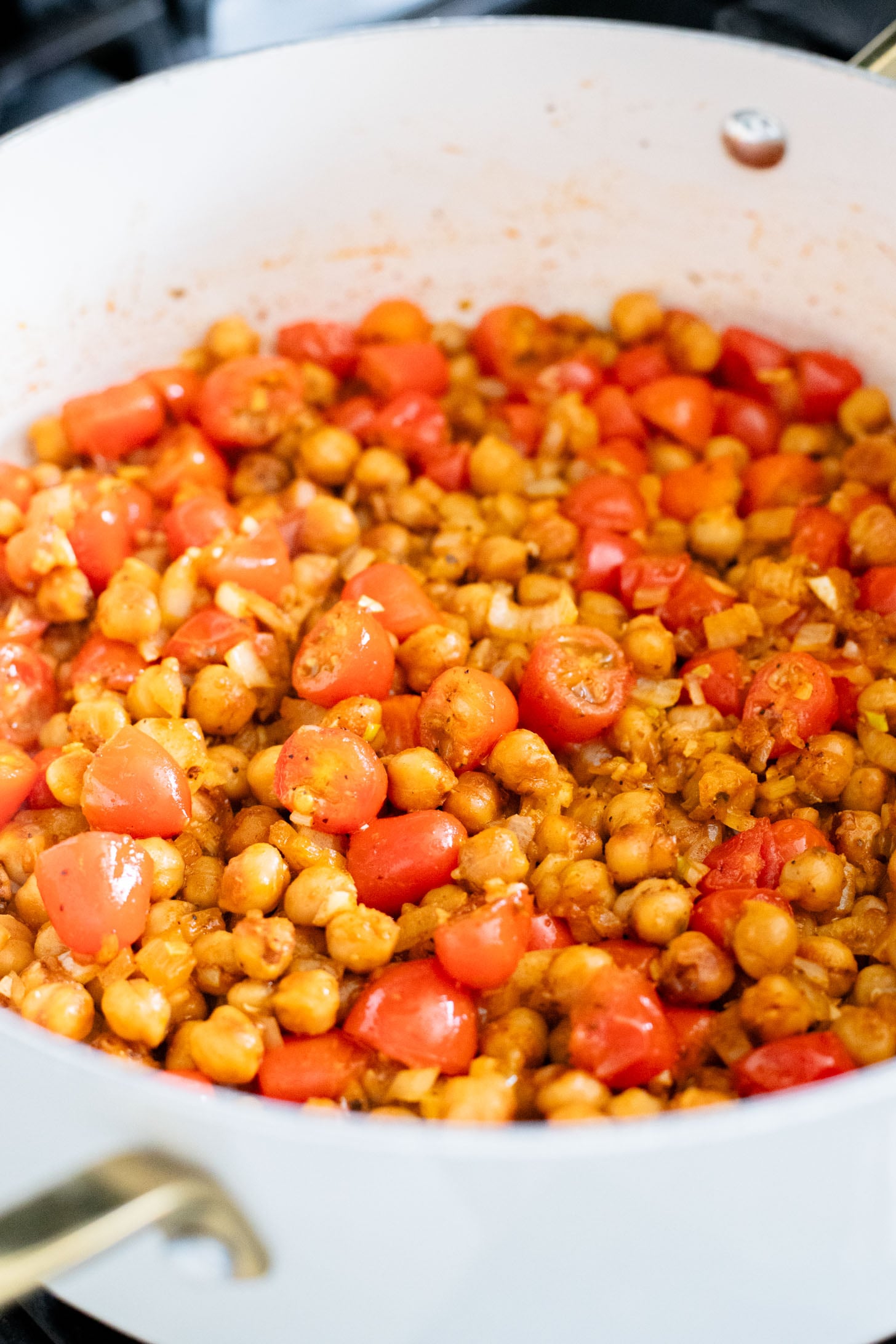 This Mediterranean Chickpea & Rice Skillet is a quick & delicious vegan dinner. Crispy chickpeas, veggies, rice & a lemony hummus sauce | ThisSavoryVegan.com