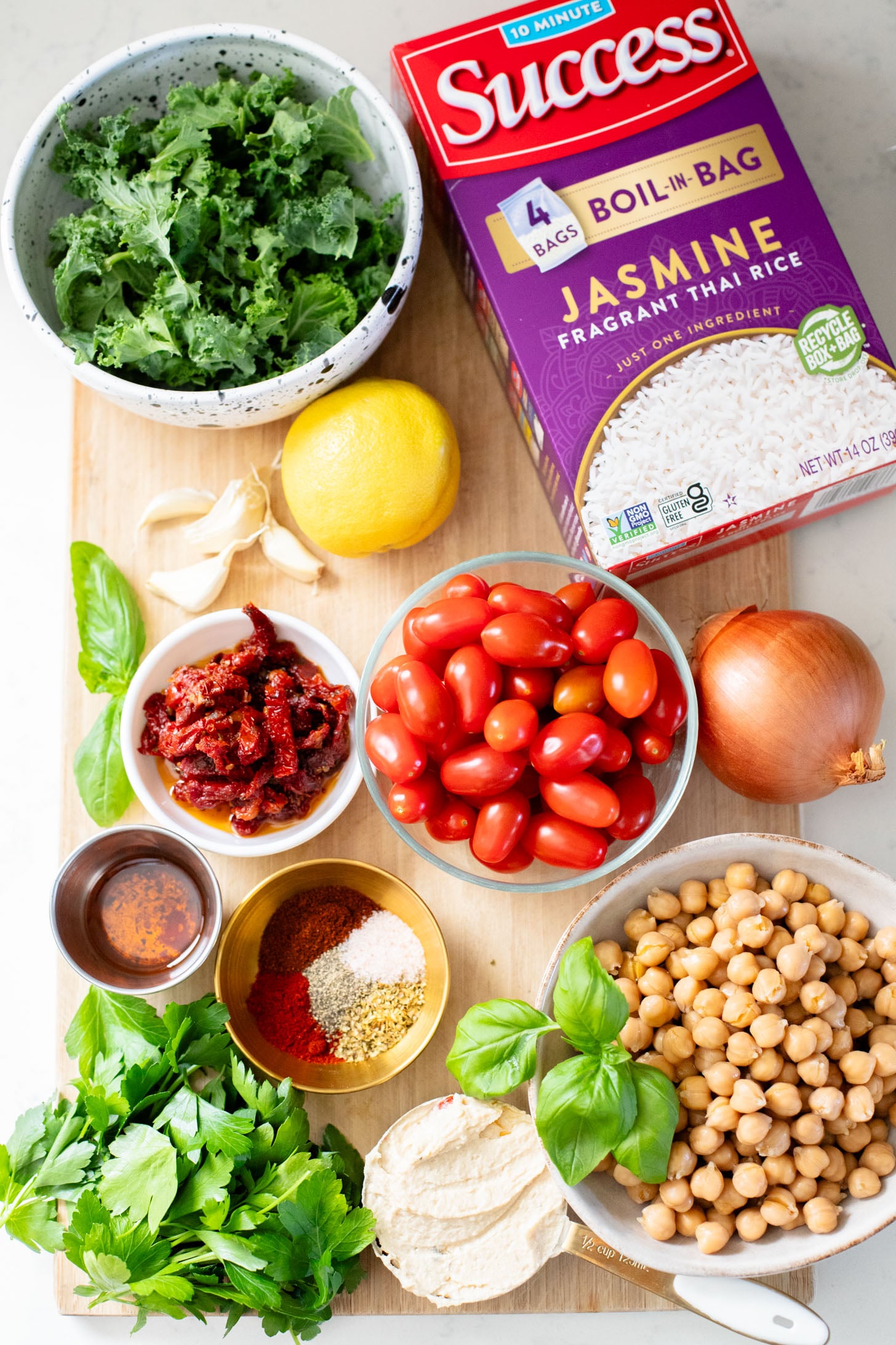 This Mediterranean Chickpea & Rice Skillet is a quick & delicious vegan dinner. Crispy chickpeas, veggies, rice & a lemony hummus sauce | ThisSavoryVegan.com