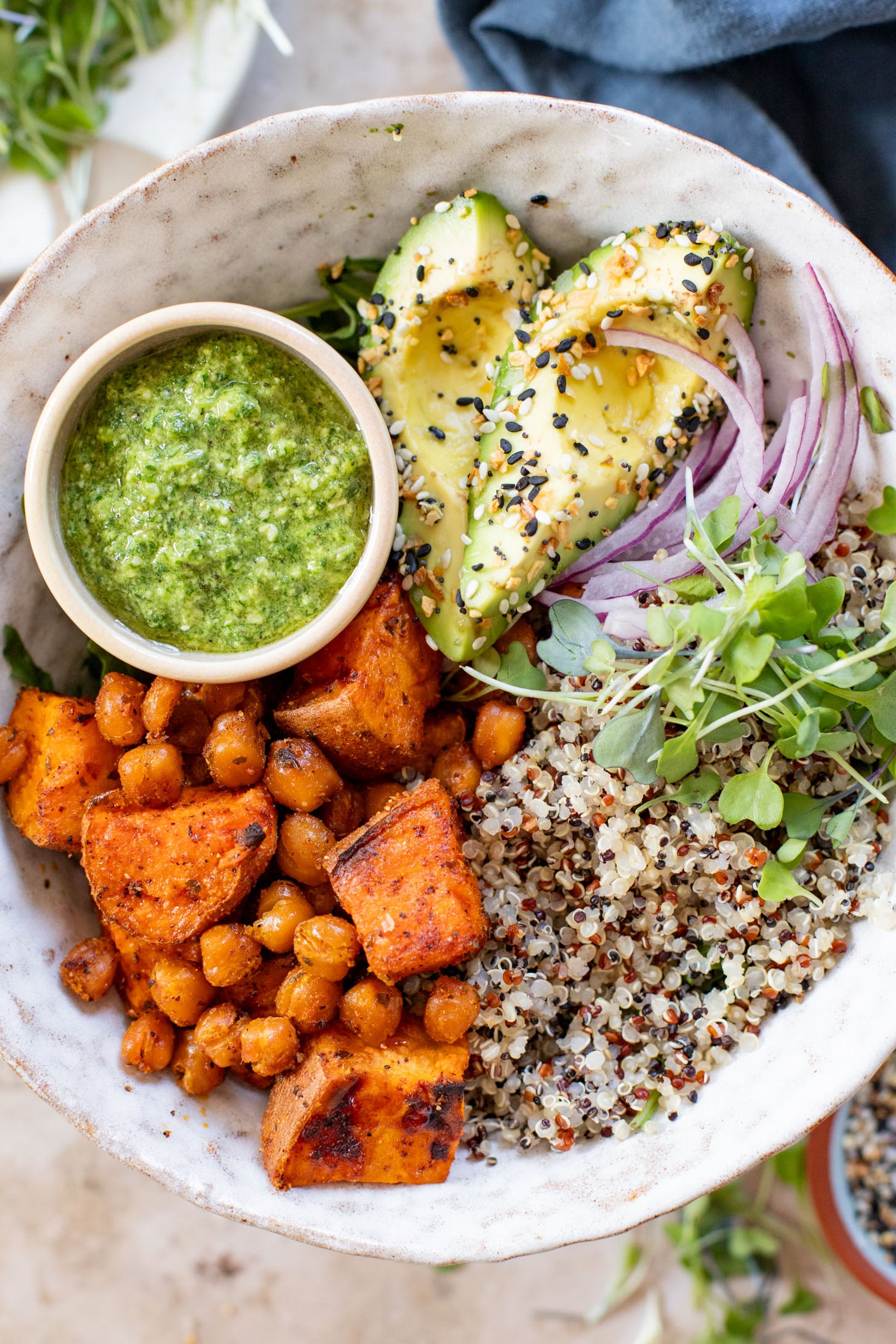 These Pesto Sweet Potato Quinoa Bowls are a super delicious vegan lunch or dinner. Packed with nutritious ingredients & plant protein | ThisSavoryVegan.com