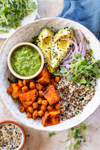 These Pesto Sweet Potato Quinoa Bowls are a super delicious vegan lunch or dinner. Packed with nutritious ingredients & plant protein | ThisSavoryVegan.com