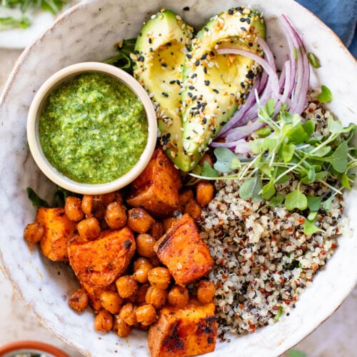These Pesto Sweet Potato Quinoa Bowls are a super delicious vegan lunch or dinner. Packed with nutritious ingredients & plant protein | ThisSavoryVegan.com