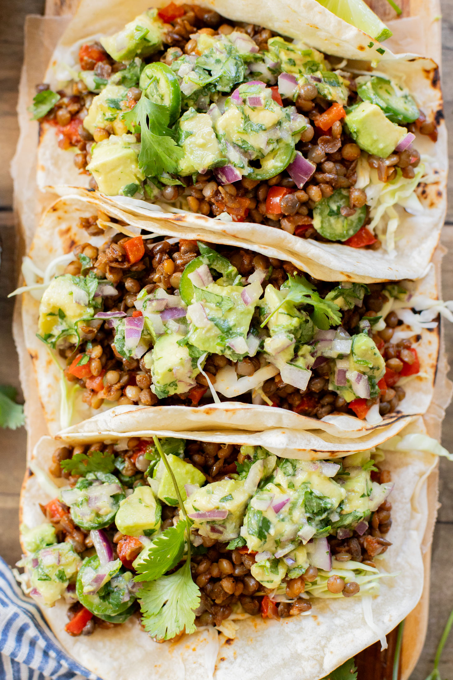 These Spicy Lentil Tacos bring the heat...and pack in some healthy, plant protein. Ready in under 30 minutes, these are perfect weeknight tacos | ThisSavoryVegan.com