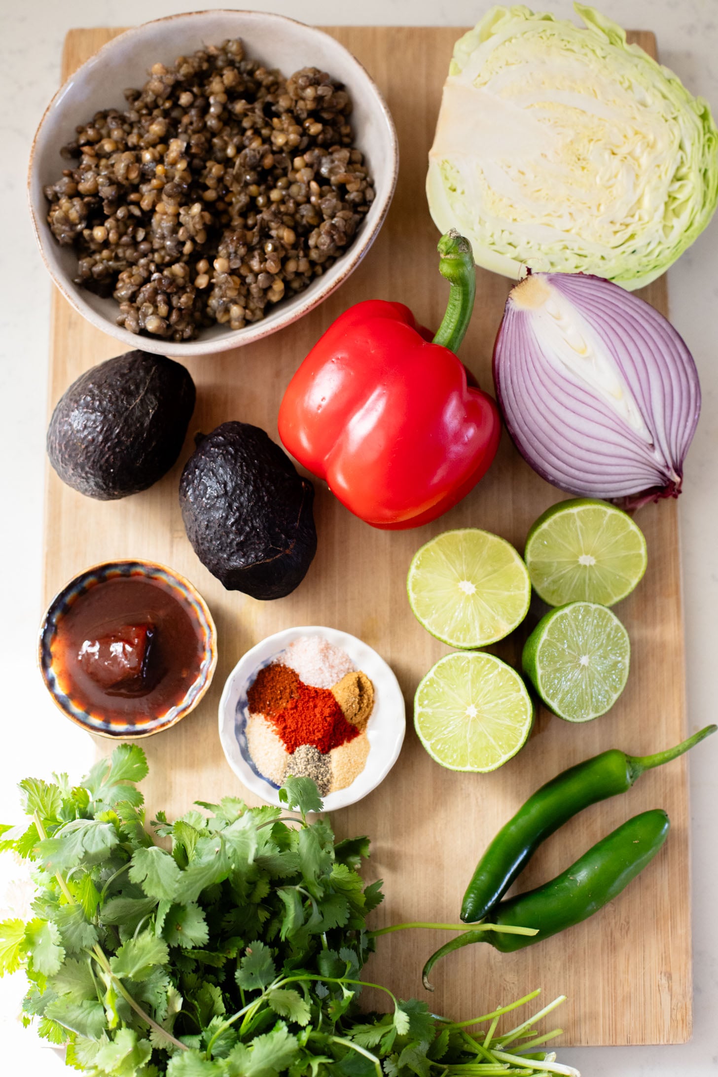 These Spicy Lentil Tacos bring the heat...and pack in some healthy, plant protein. Ready in under 30 minutes, these are perfect weeknight tacos | ThisSavoryVegan.com