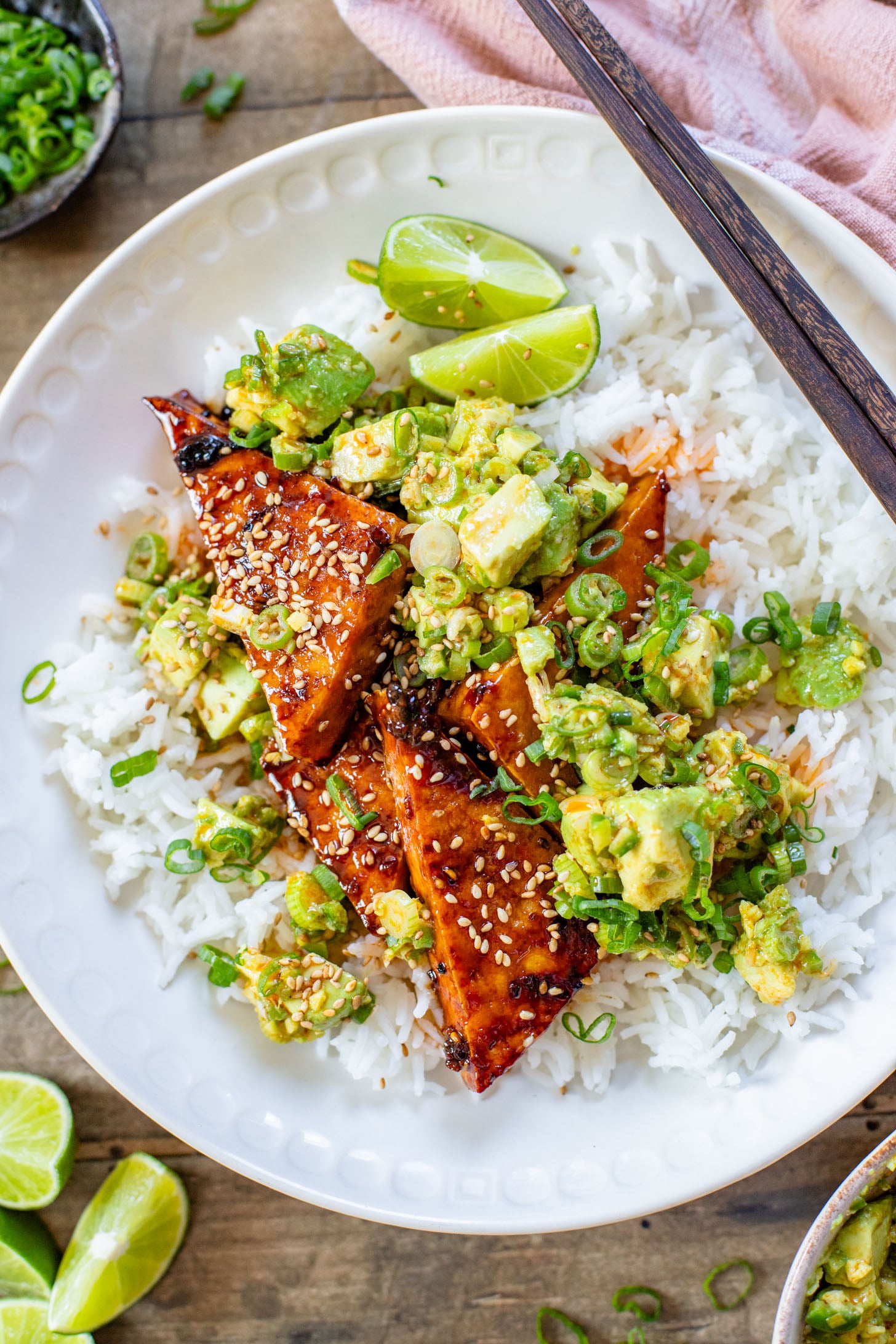 These Teriyaki Tofu Rice Bowls are a quick weeknight dinner. The tofu is sticky & crispy and is topped off with a ginger avocado salsa | ThisSavoryVegan.com