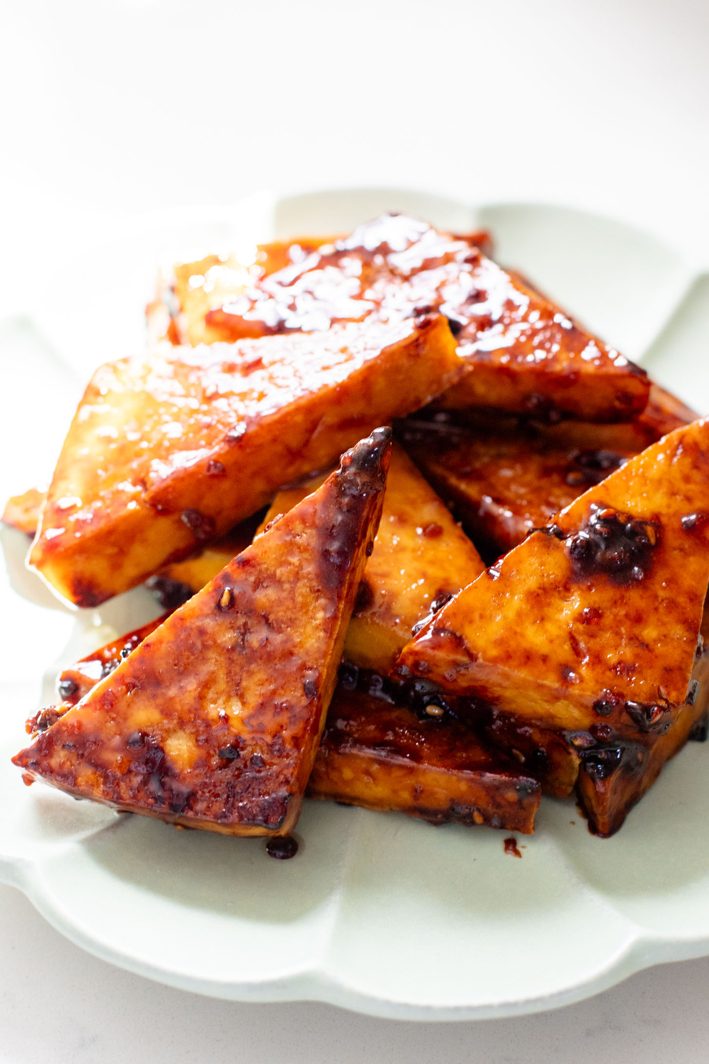 These Teriyaki Tofu Rice Bowls are a quick weeknight dinner. The tofu is sticky & crispy and is topped off with a ginger avocado salsa | ThisSavoryVegan.com