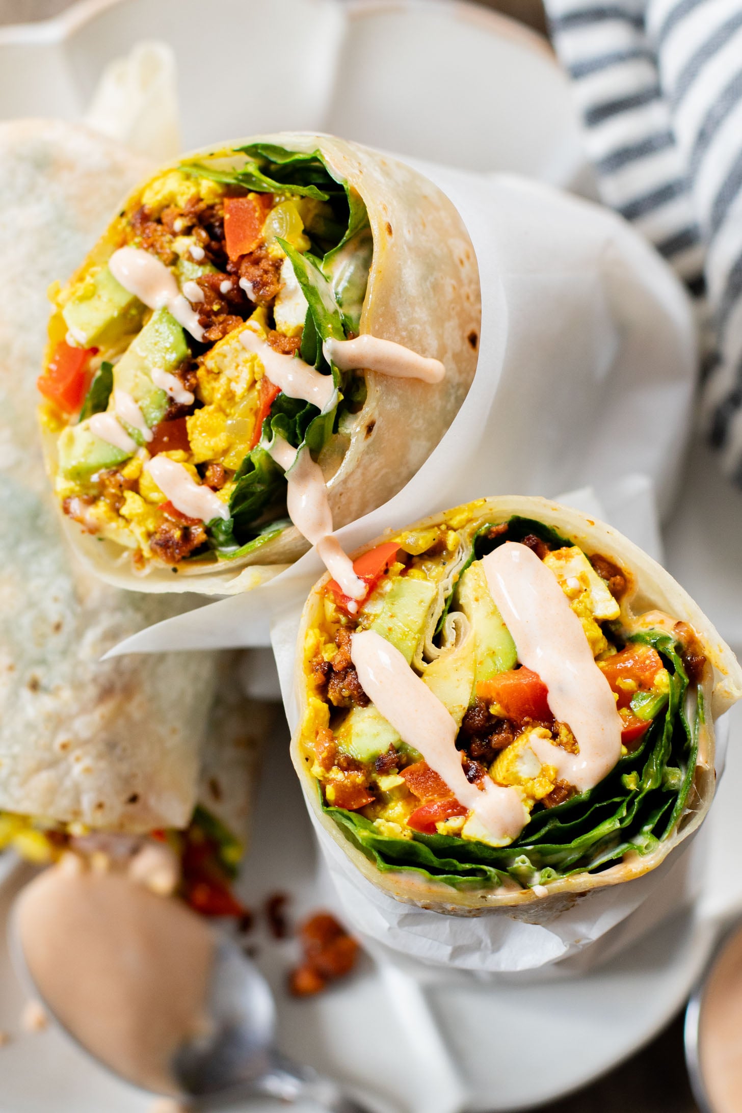 These Tofu Scramble Breakfast Burritos are the perfect vegan brunch idea! Filled with a tasty tofu scramble, soyrizo & avocado | ThisSavoryVegan.com
