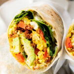 These Tofu Scramble Breakfast Burritos are the perfect vegan brunch idea! Filled with a tasty tofu scramble, soyrizo & avocado | ThisSavoryVegan.com