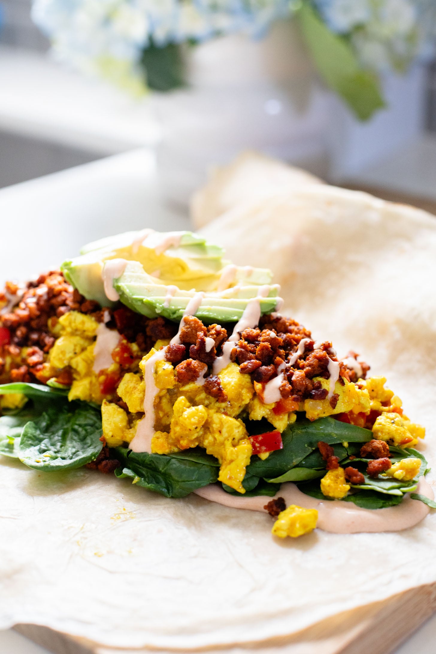These Tofu Scramble Breakfast Burritos are the perfect vegan brunch idea! Filled with a tasty tofu scramble, soyrizo & avocado | ThisSavoryVegan.com