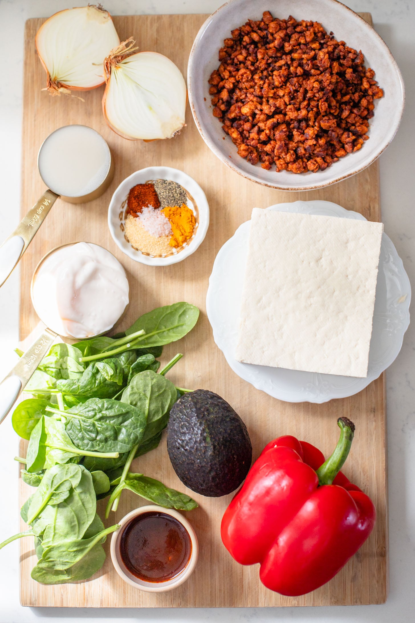 These Tofu Scramble Breakfast Burritos are the perfect vegan brunch idea! Filled with a tasty tofu scramble, soyrizo & avocado | ThisSavoryVegan.com