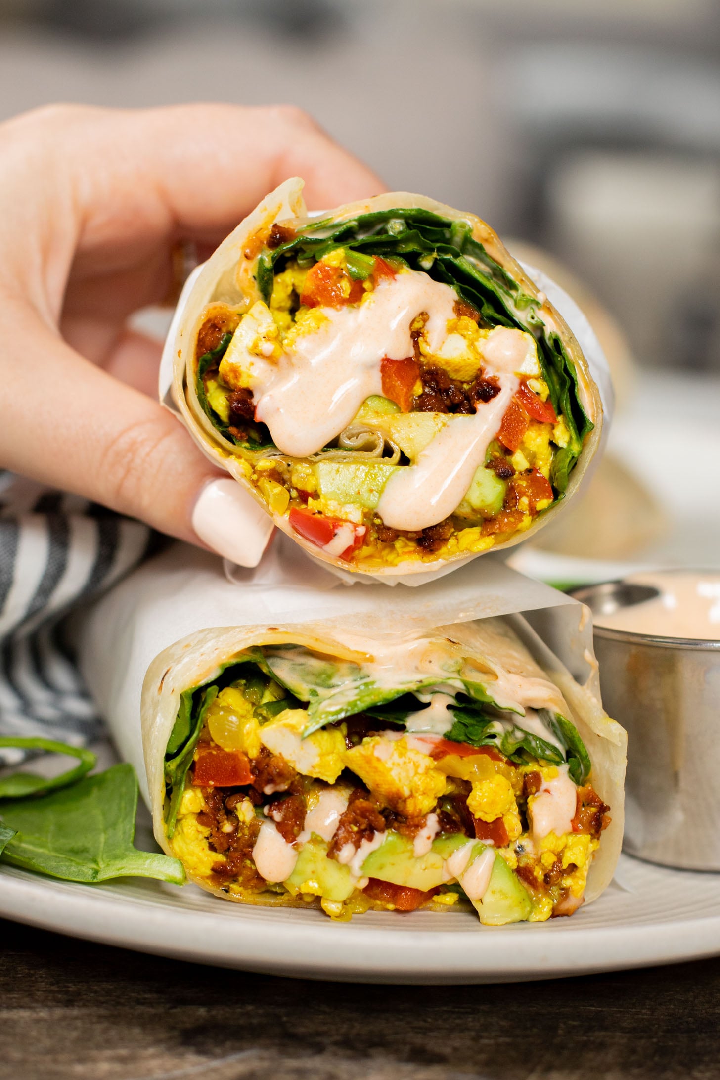 These Tofu Scramble Breakfast Burritos are the perfect vegan brunch idea! Filled with a tasty tofu scramble, soyrizo & avocado | ThisSavoryVegan.com