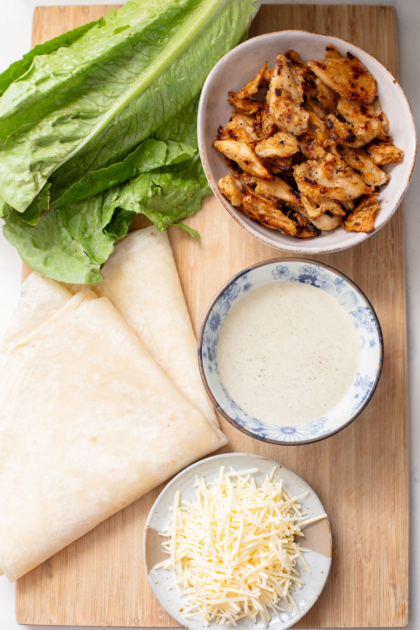 These Vegan Chicken Caesar Wraps are the best way to eat your favorite Caesar salad on-the-go! Delicious flavors and dairy-free | ThisSavoryVegan.com