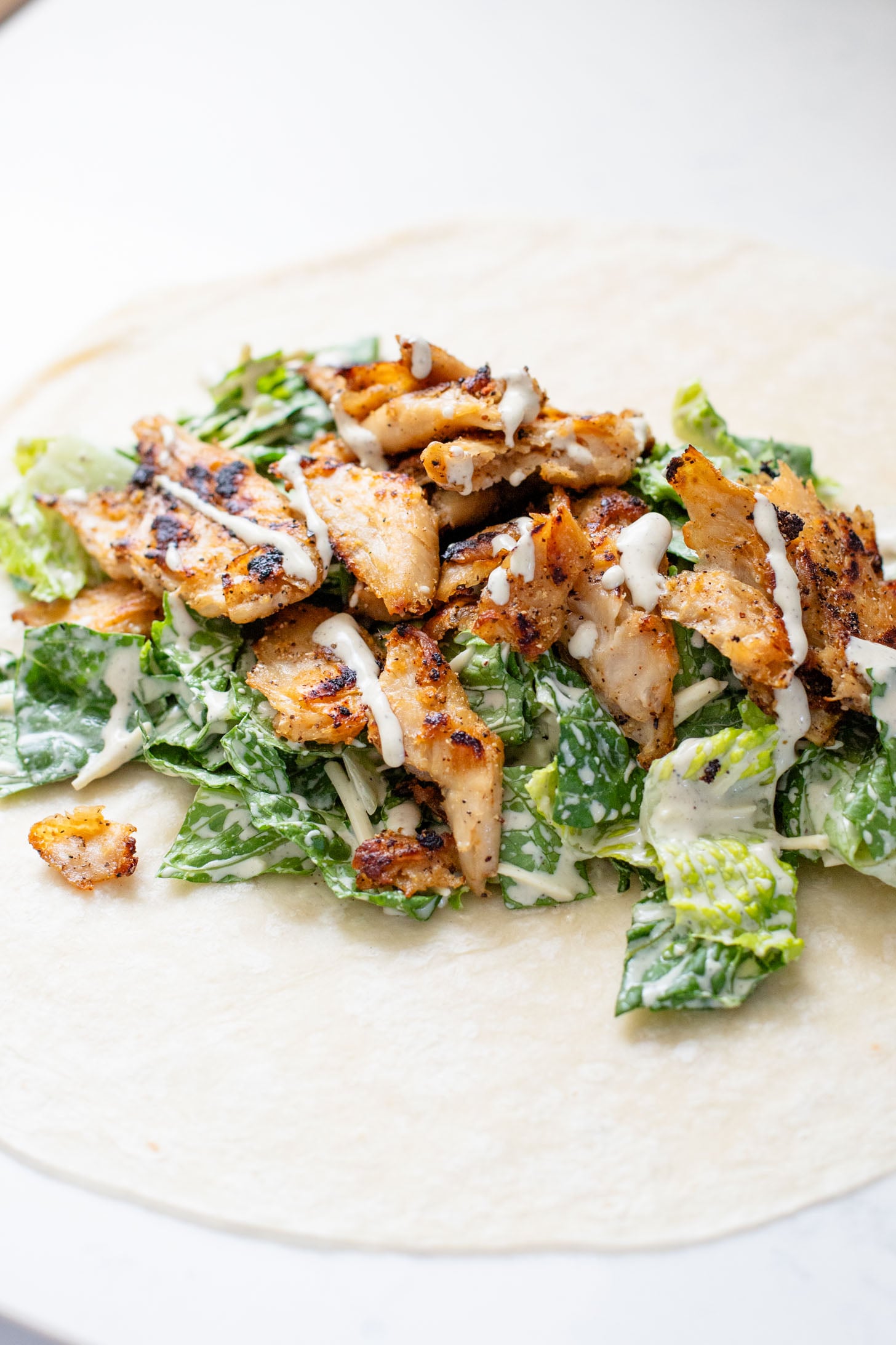 These Vegan Chicken Caesar Wraps are the best way to eat your favorite Caesar salad on-the-go! Delicious flavors and dairy-free | ThisSavoryVegan.com