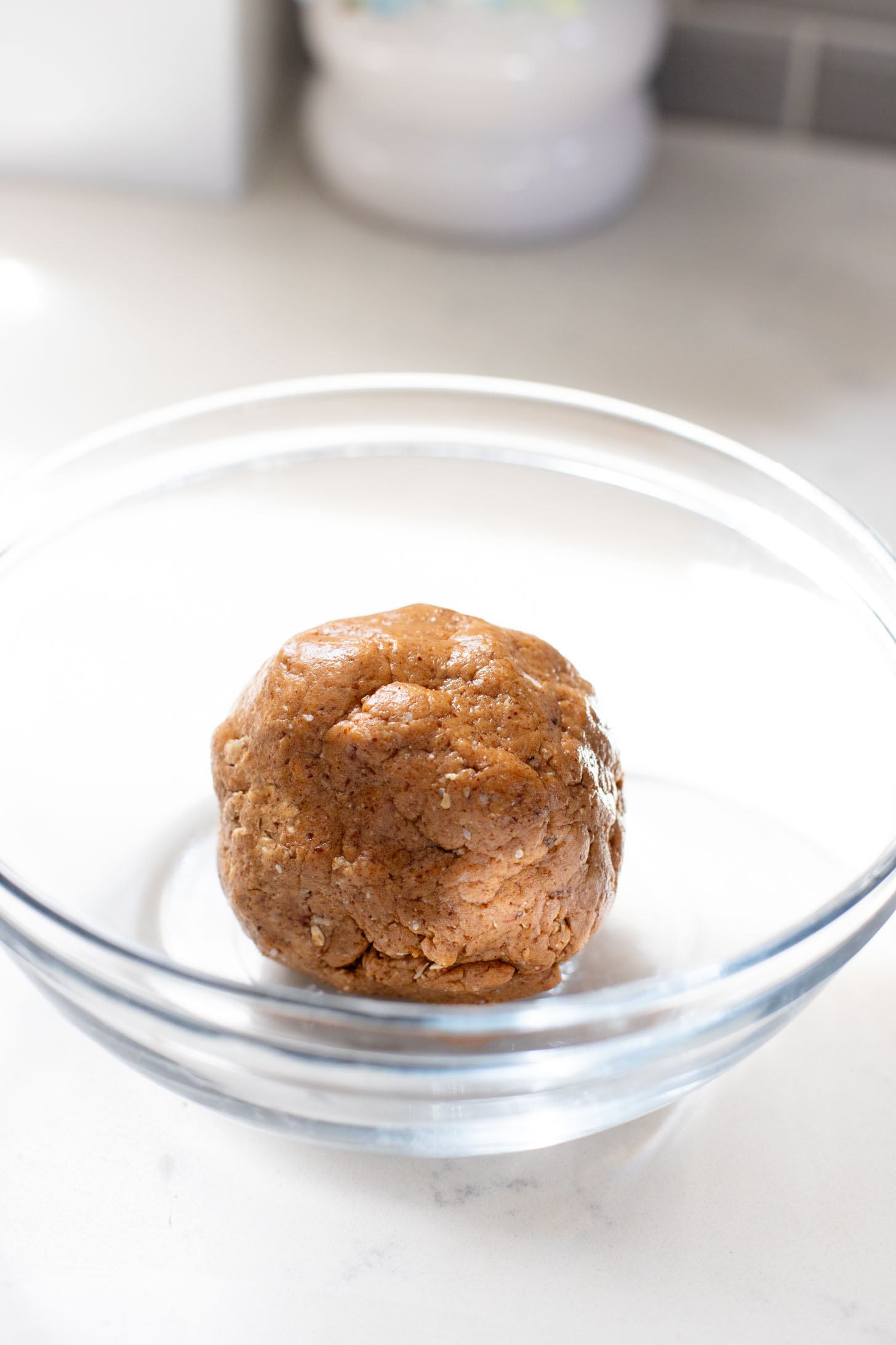 These Almond Coconut Date Balls are a protein-packed vegan dessert or snack that everyone will love! Dipped in chocolate & sprinkled with coconut | ThisSavoryVegan.com