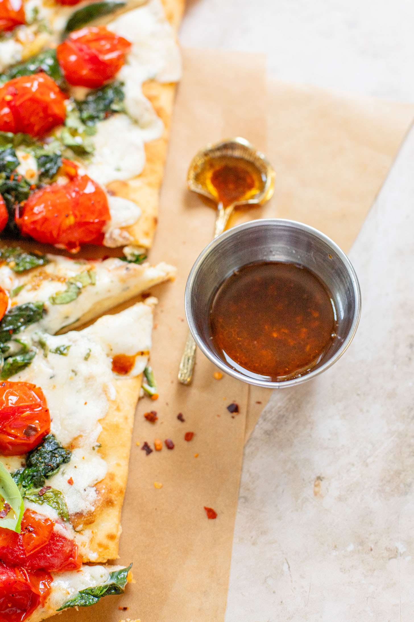 This Burst Tomato Flatbread is a delicious summer recipe! Made with dairy-free cheese and topped with balsamic burst cherry tomatoes | ThisSavoryVegan.com