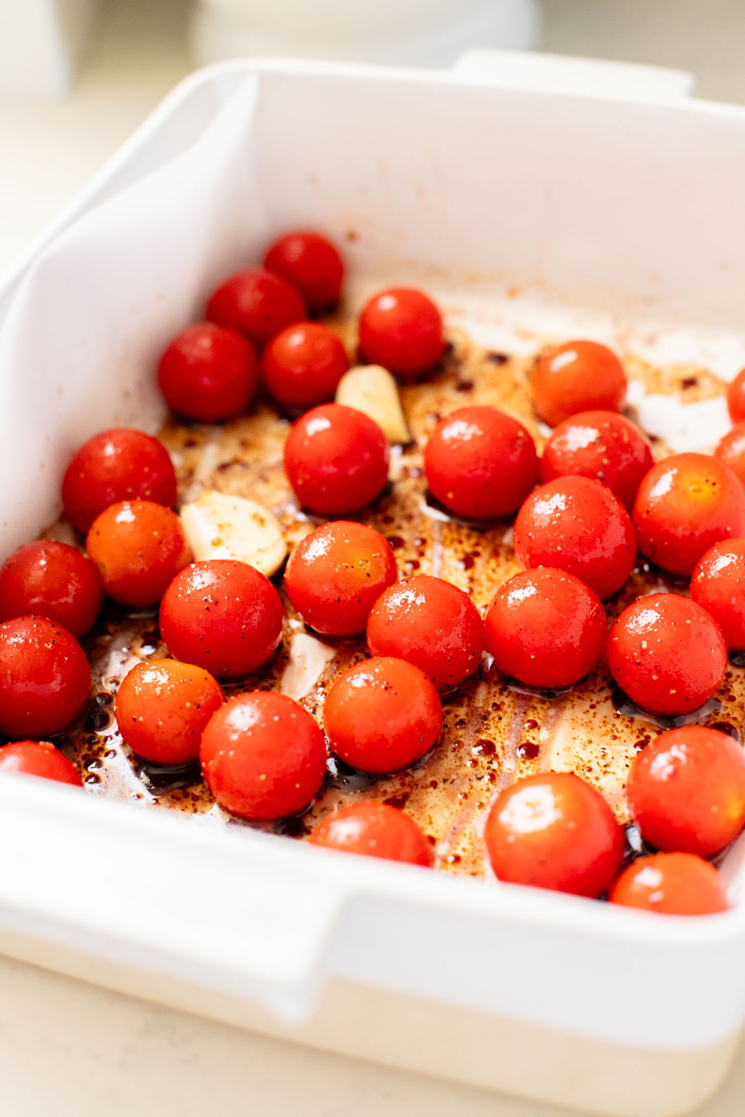 This Burst Tomato Flatbread is a delicious summer recipe! Made with dairy-free cheese and topped with balsamic burst cherry tomatoes | ThisSavoryVegan.com