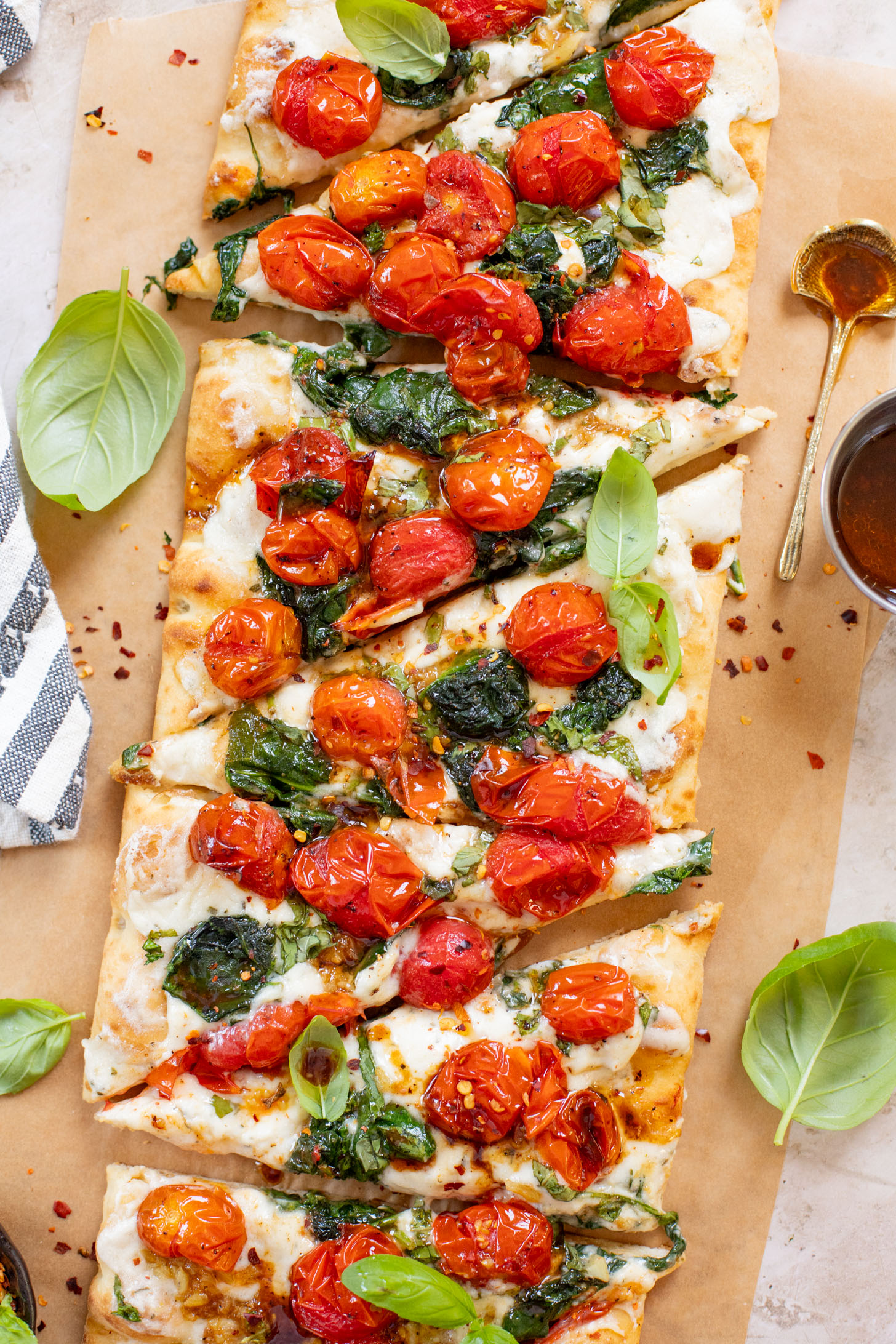 This Burst Tomato Flatbread is a delicious summer recipe! Made with dairy-free cheese and topped with balsamic burst cherry tomatoes | ThisSavoryVegan.com