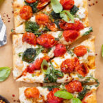 This Burst Tomato Flatbread is a delicious summer recipe! Made with dairy-free cheese and topped with balsamic burst cherry tomatoes | ThisSavoryVegan.com