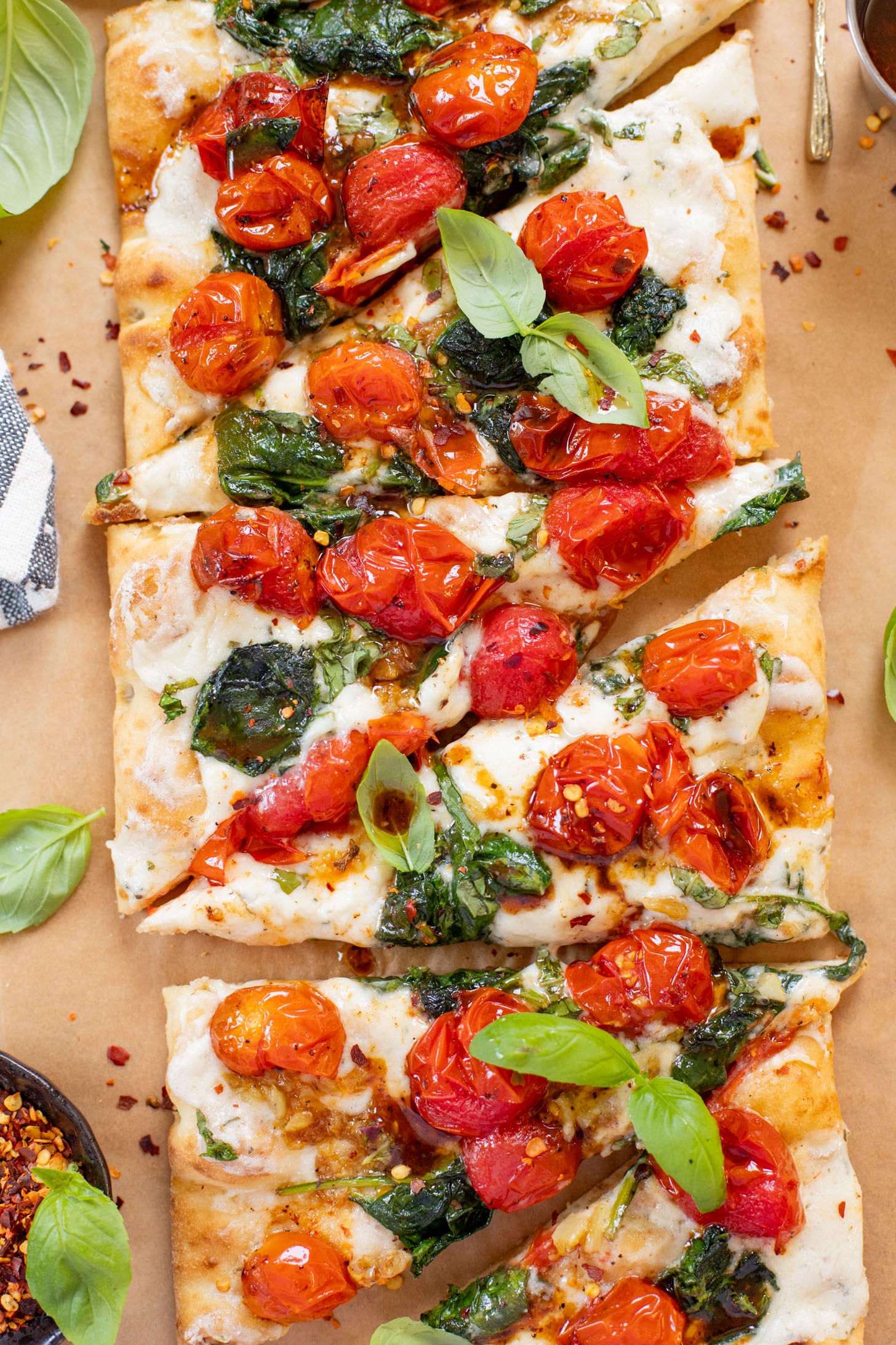 This Burst Tomato Flatbread is a delicious summer recipe! Made with dairy-free cheese and topped with balsamic burst cherry tomatoes | ThisSavoryVegan.com