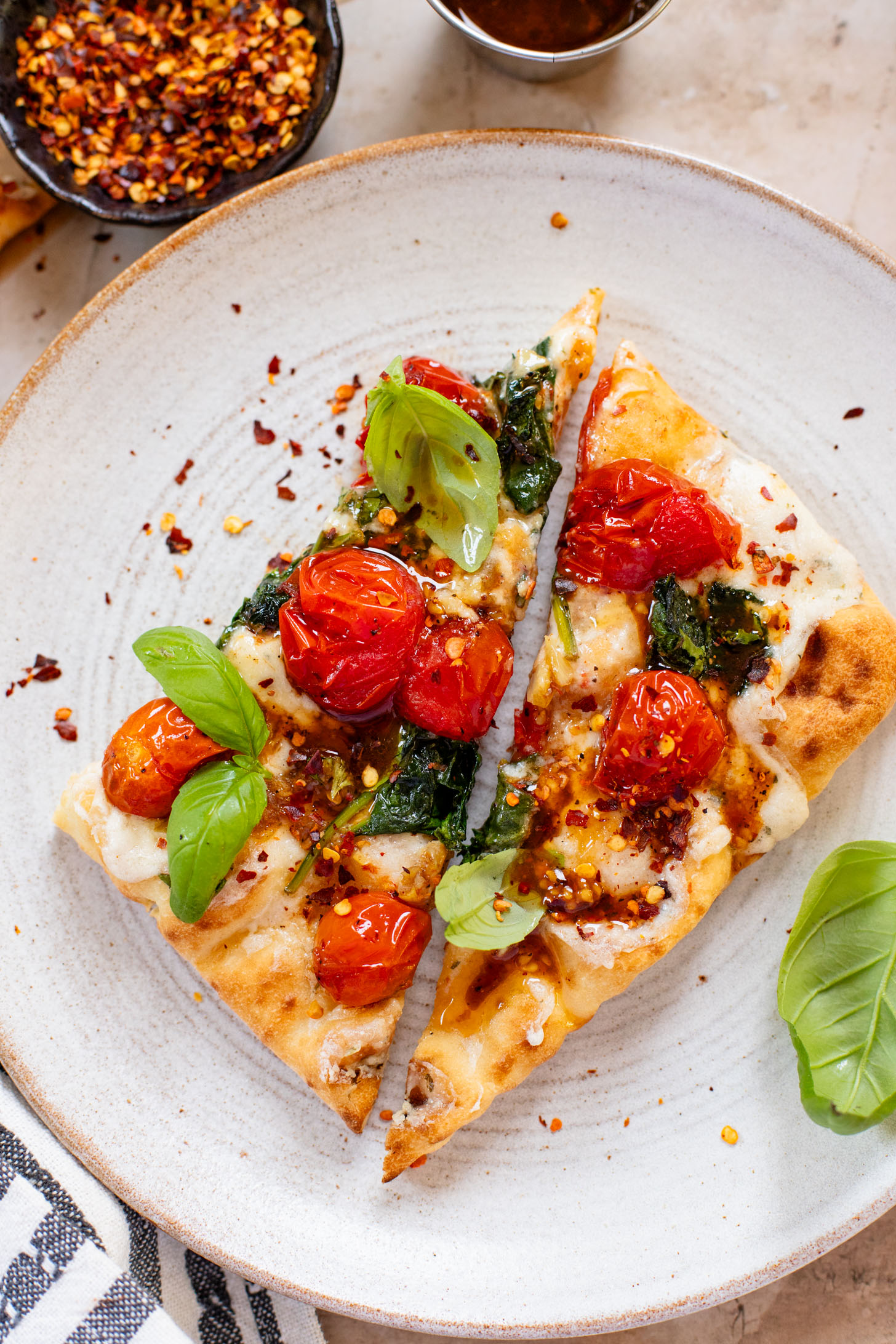 This Burst Tomato Flatbread is a delicious summer recipe! Made with dairy-free cheese and topped with balsamic burst cherry tomatoes | ThisSavoryVegan.com