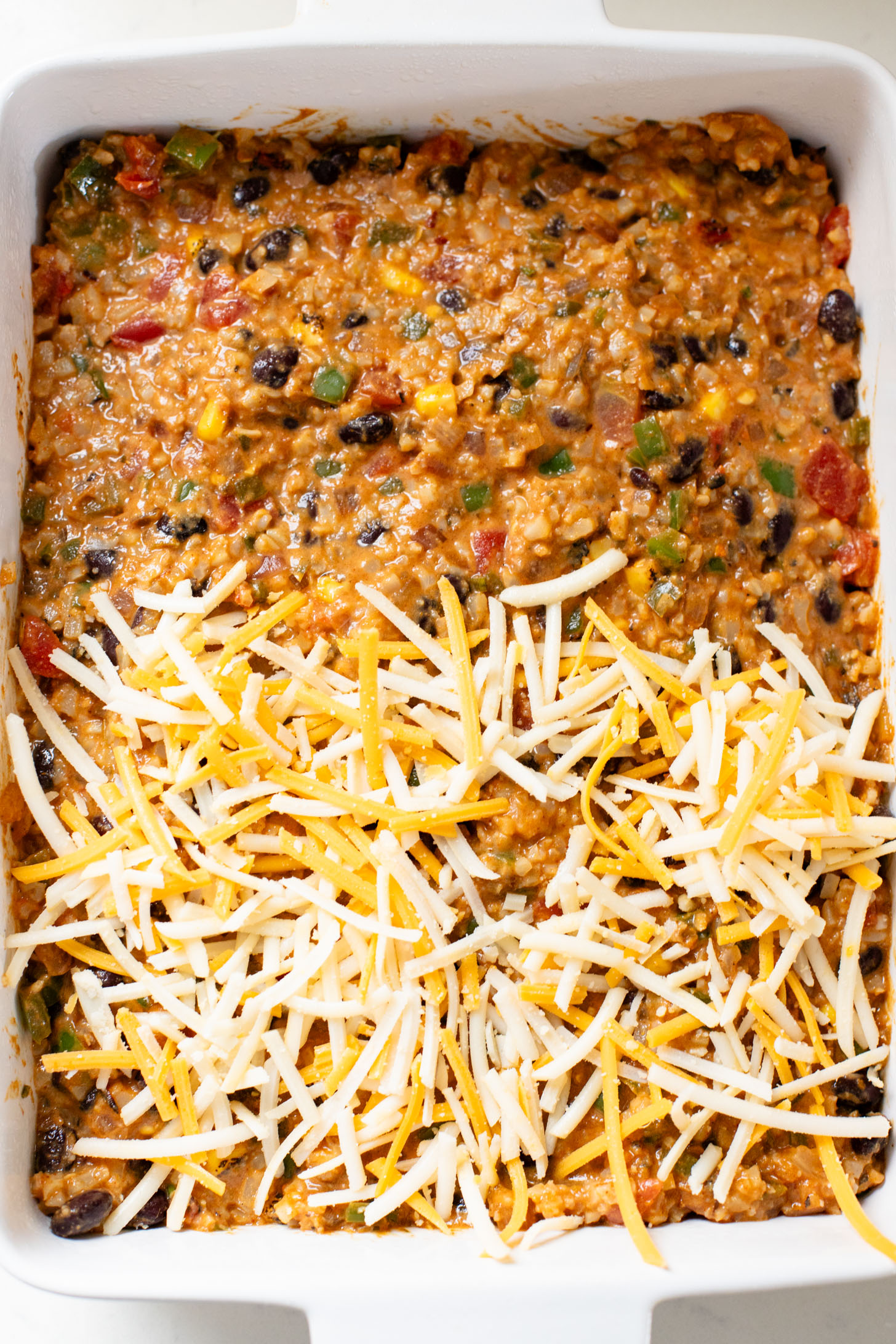 This Cauliflower Rice Taco Casserole is the perfect low-carb weeknight dinner. Packed with veggies, plant protein & also dairy-free | ThisSavoryVegan.com