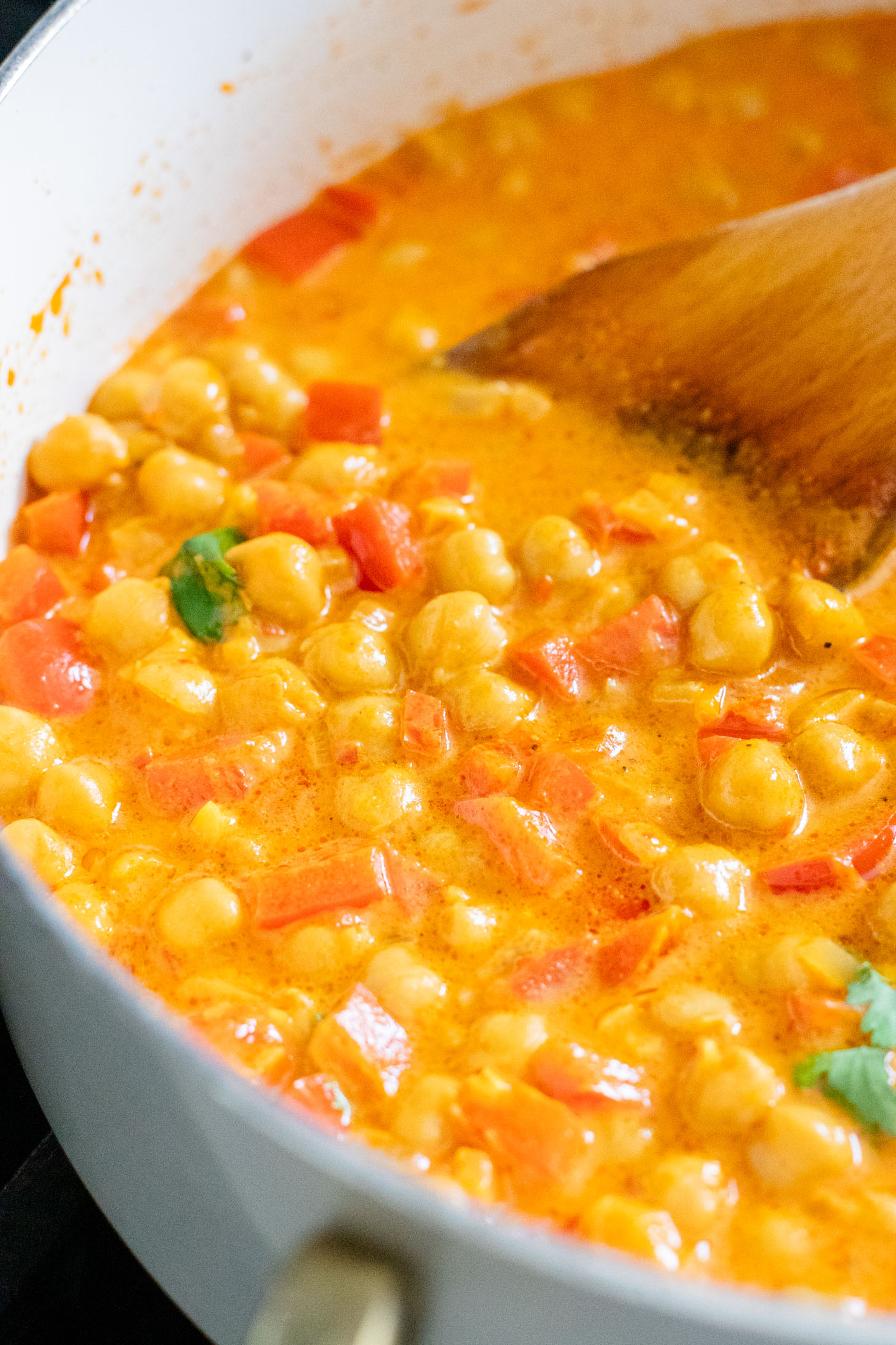 This Coconut Harissa Chickpea Skillet is an easy weeknight dinner that is dairy-free and packs in veggies & plant protein in a creamy sauce | ThisSavoryVegan.com
